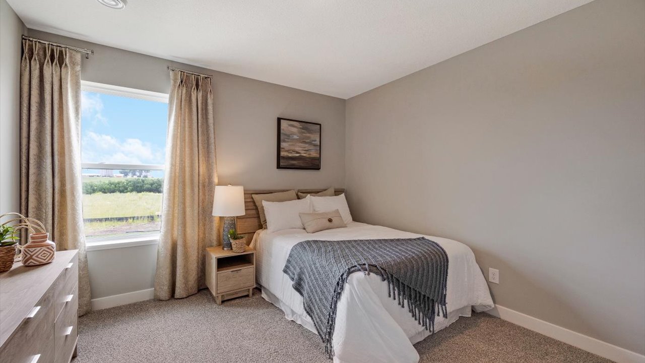 bedroom with neutral decorations and corner bedroom.