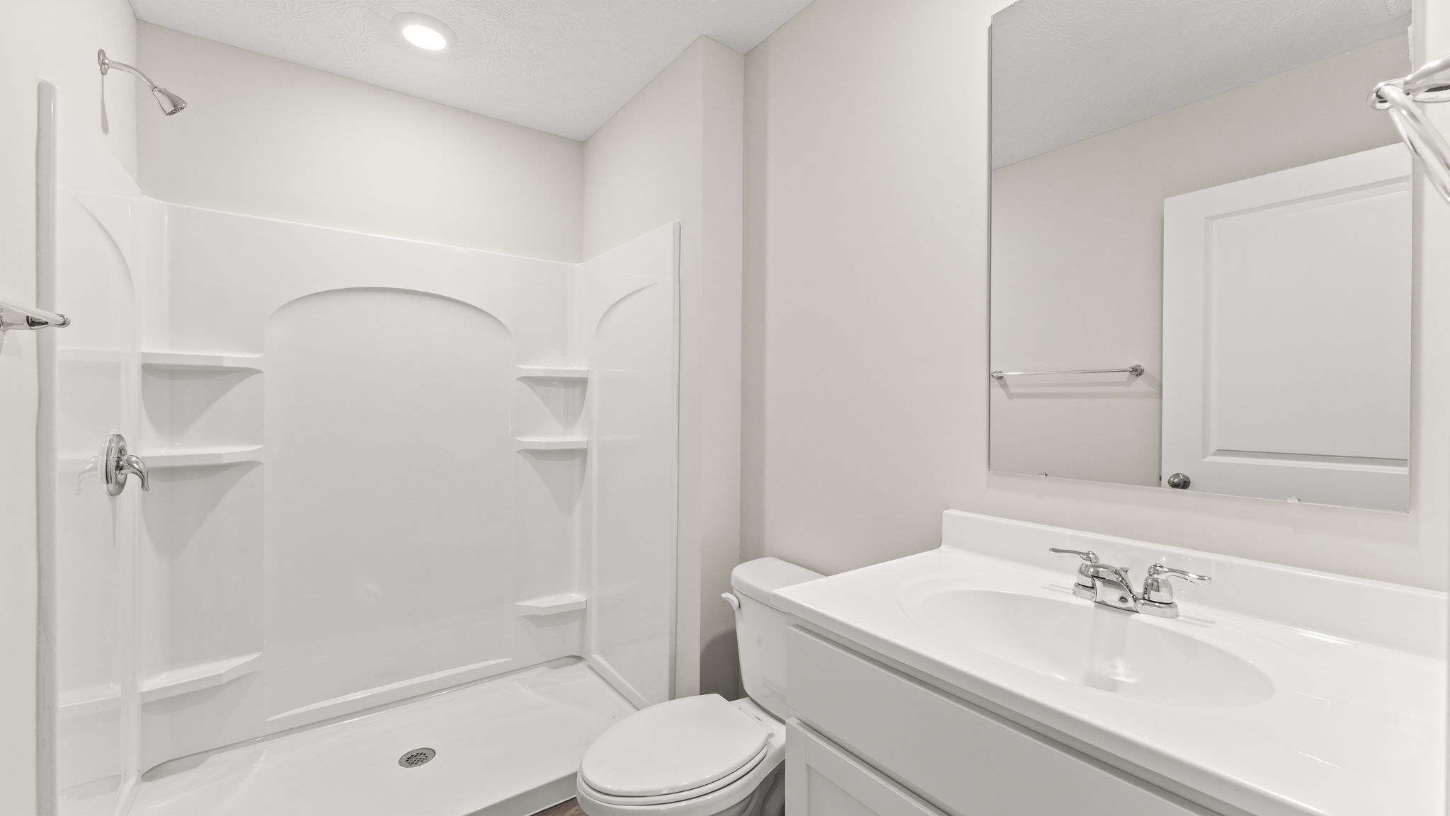 Bathroom with sink and walk-in shower