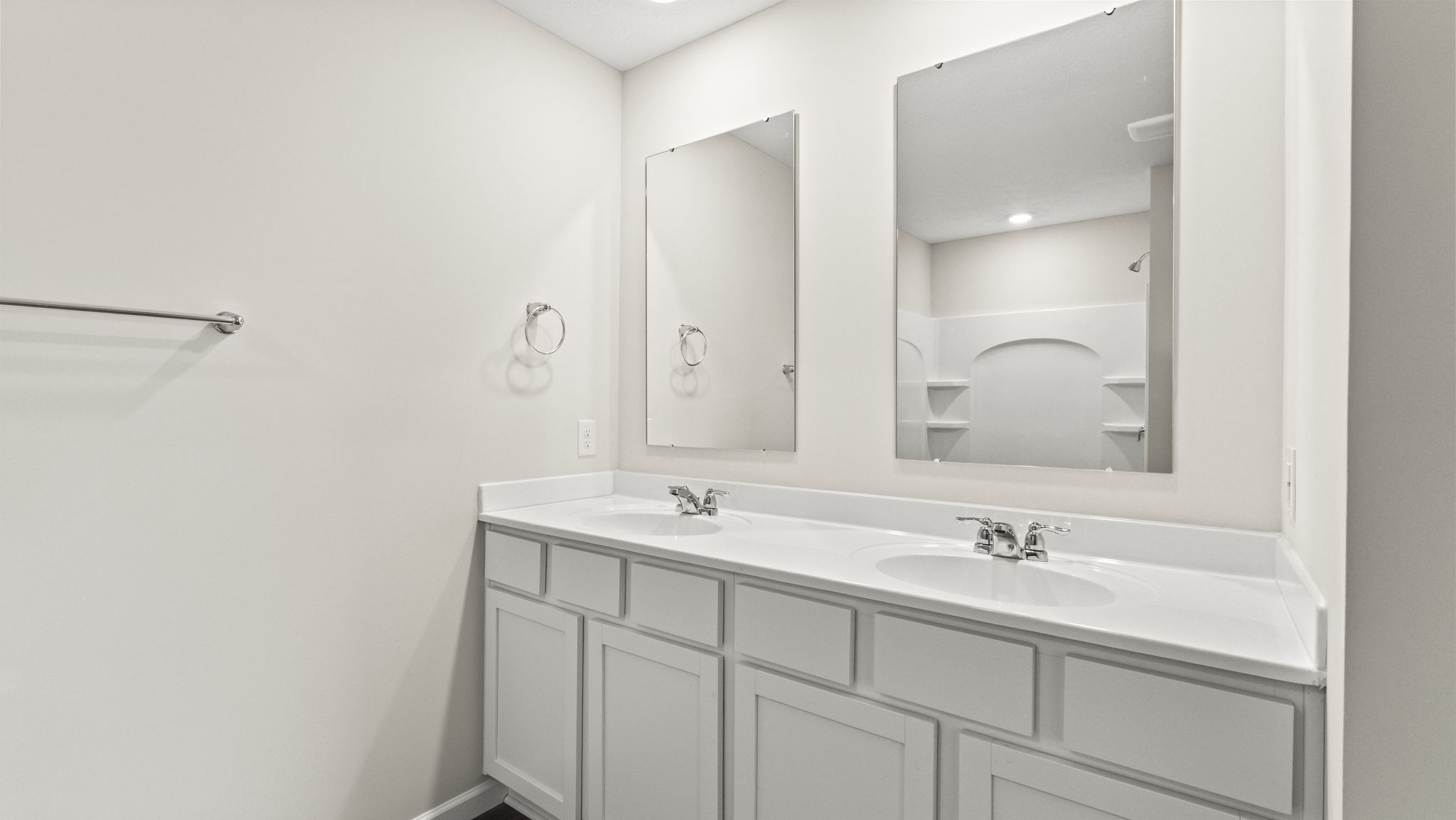 Closeup of dual vanity sink with double mirrors