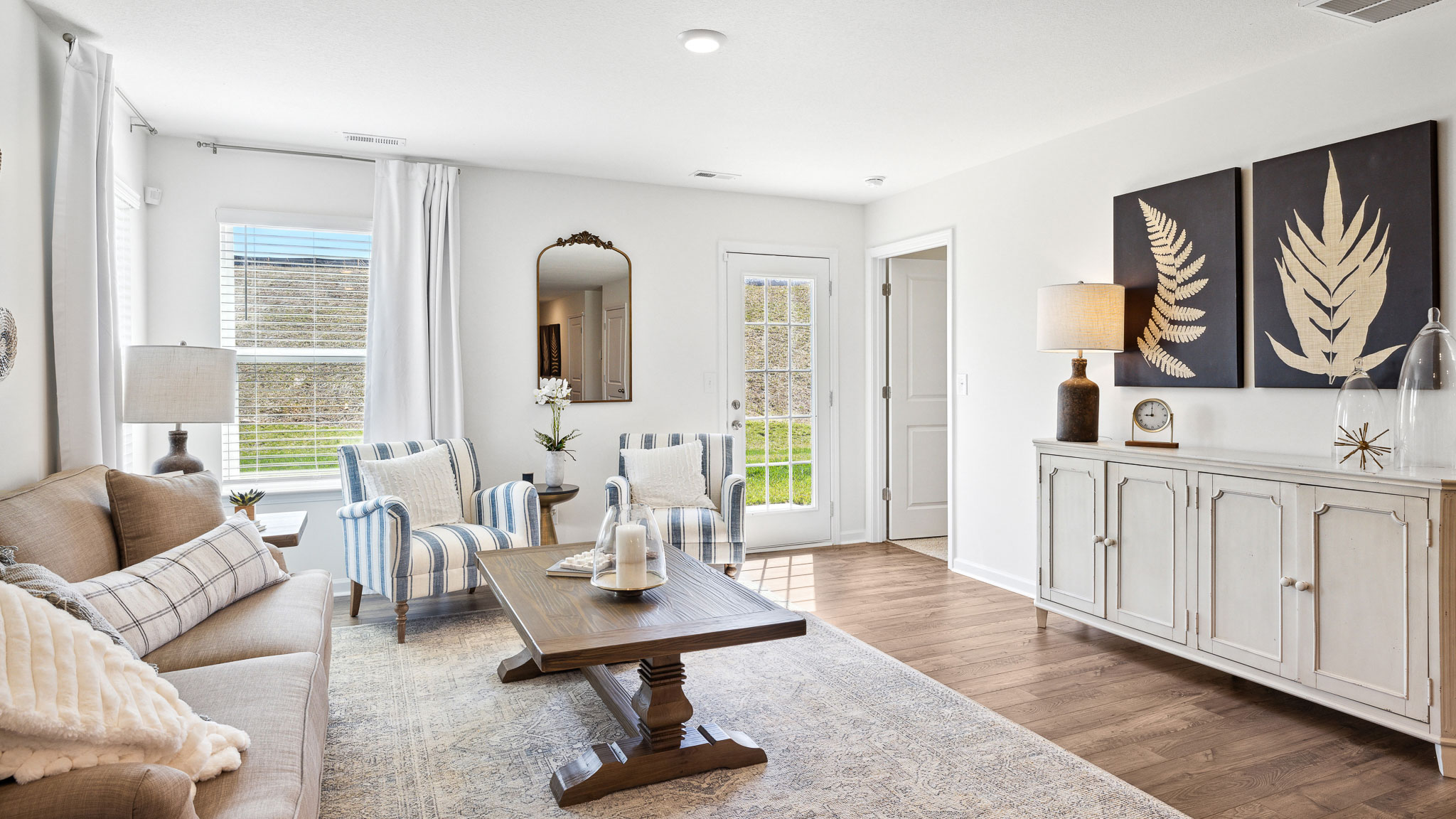 Living room leading into primary bedroom