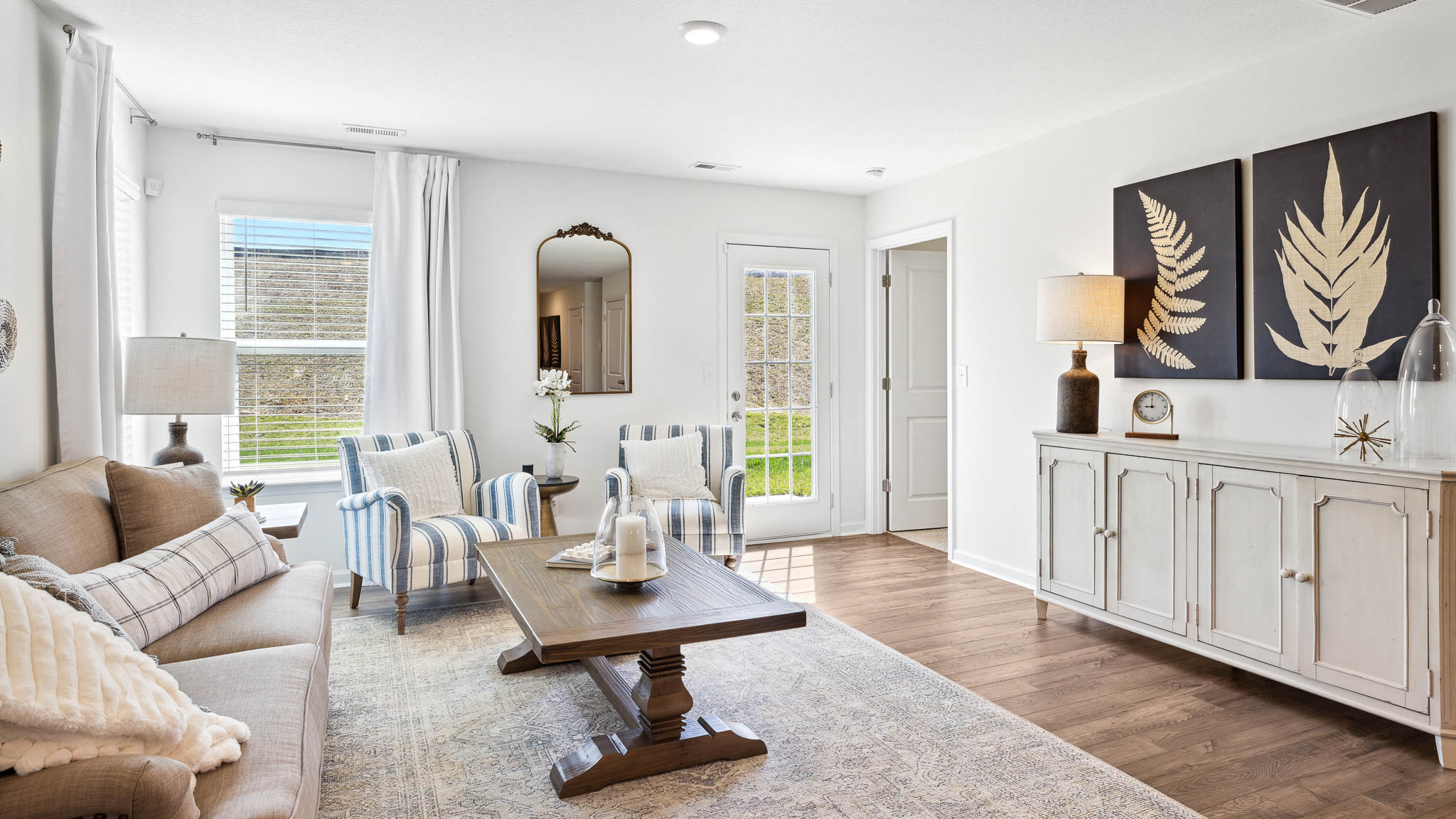Living room leading into primary bedroom