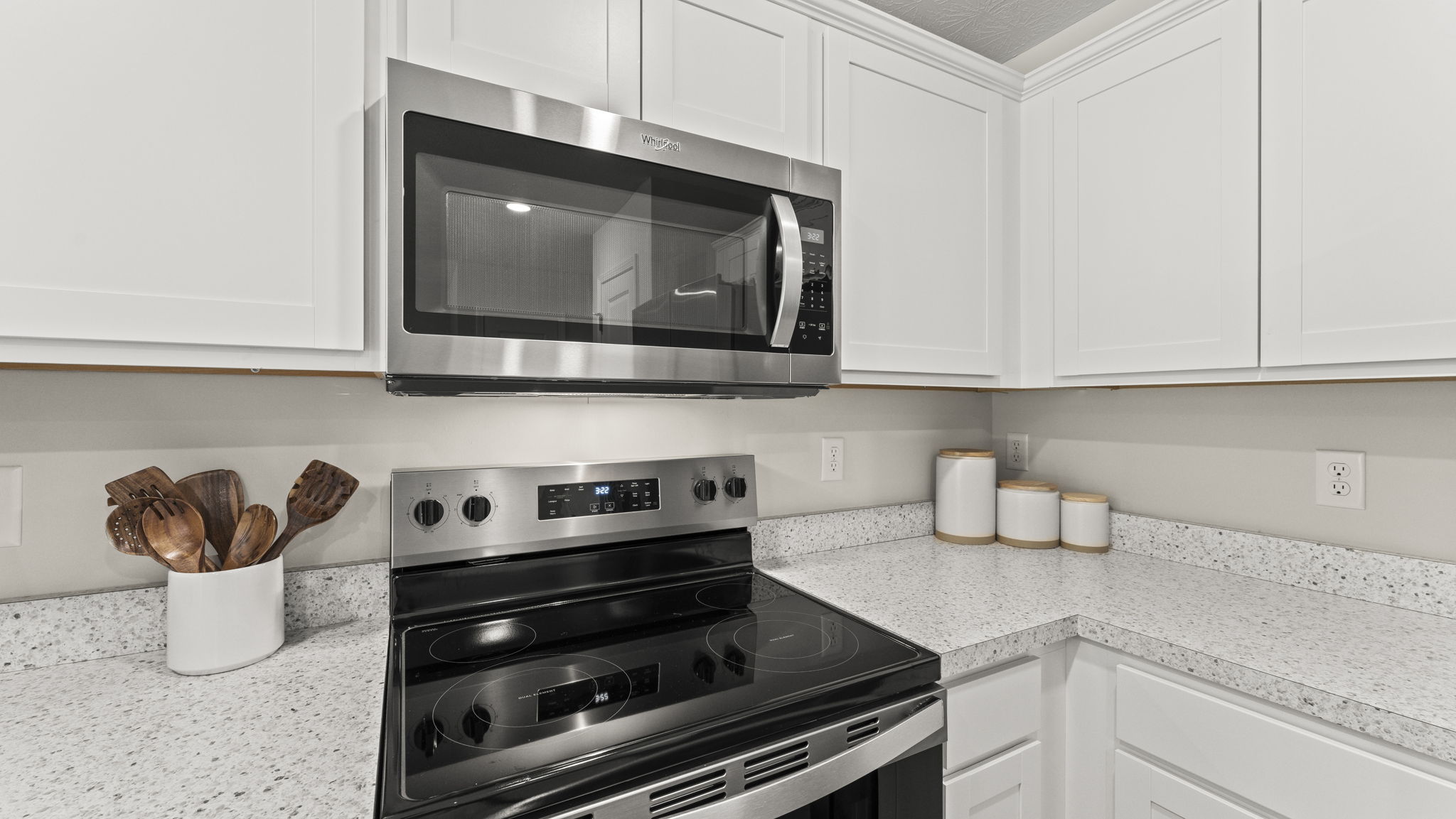 Kitchen with Stainless steel and white cabinets.