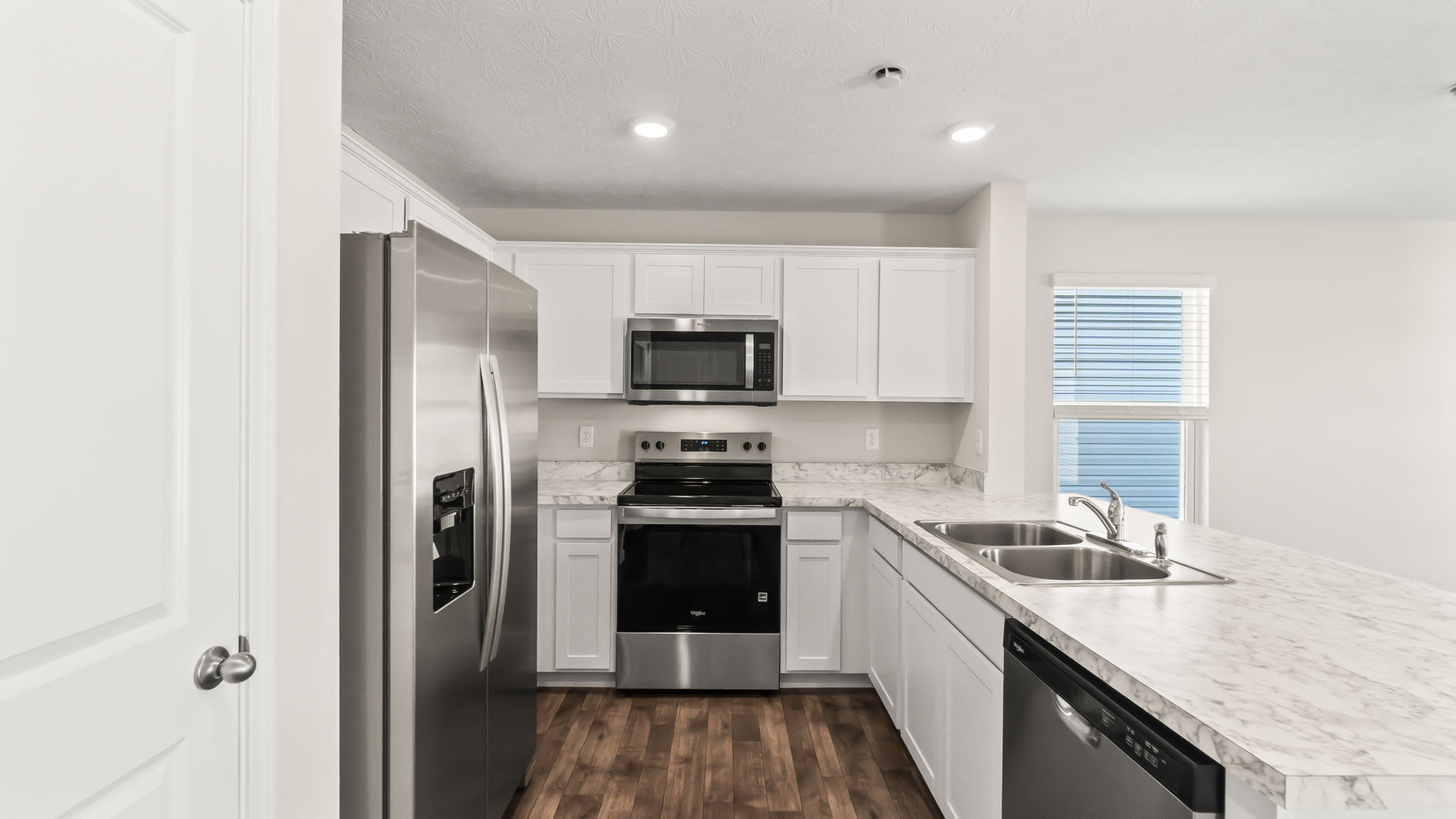 side view of kitchen with stainless steel appliances