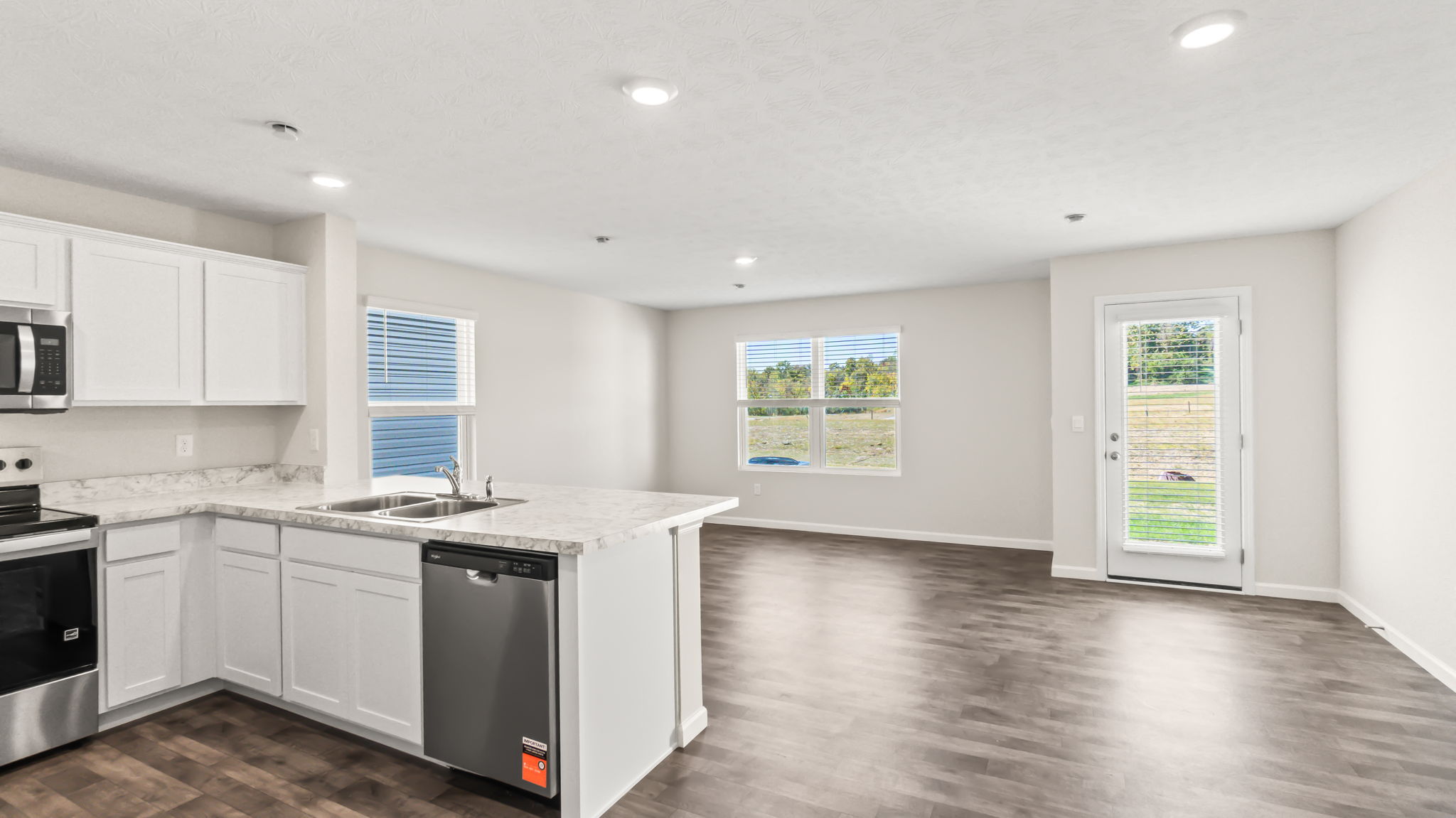 Wide view of  kitchen and great room