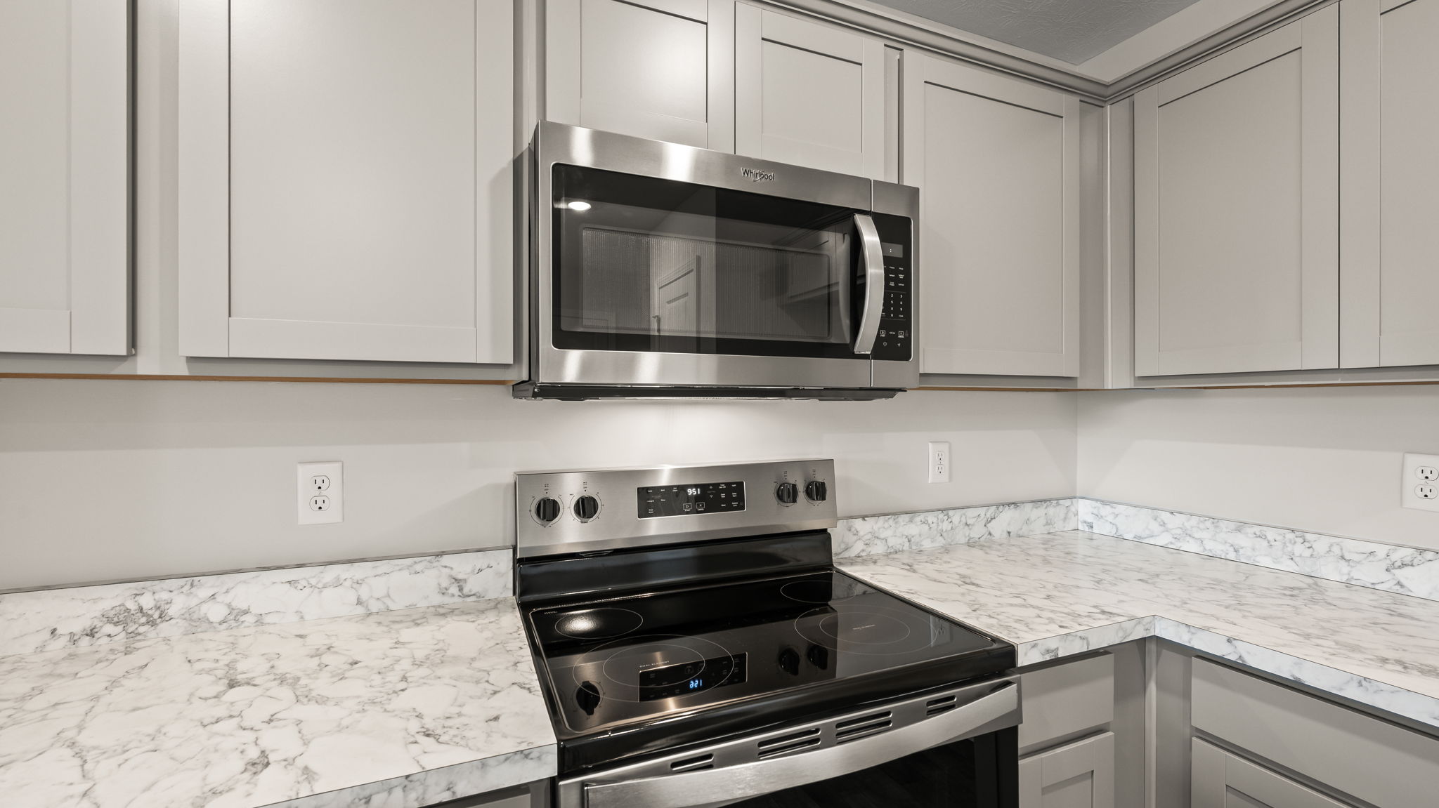 Closeup of oven range between laminate countertops