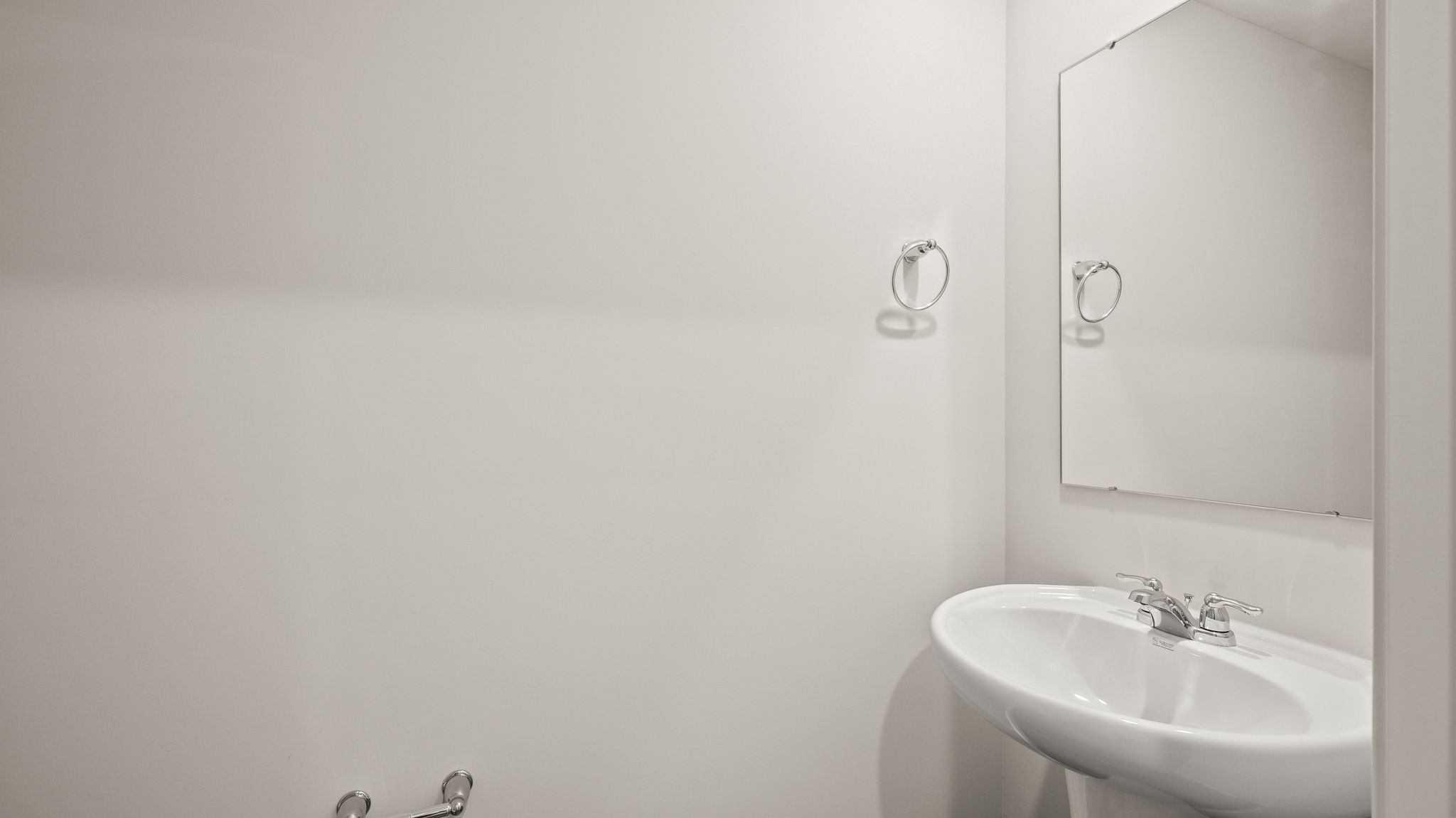 Powder room bathroom with sink and mirror