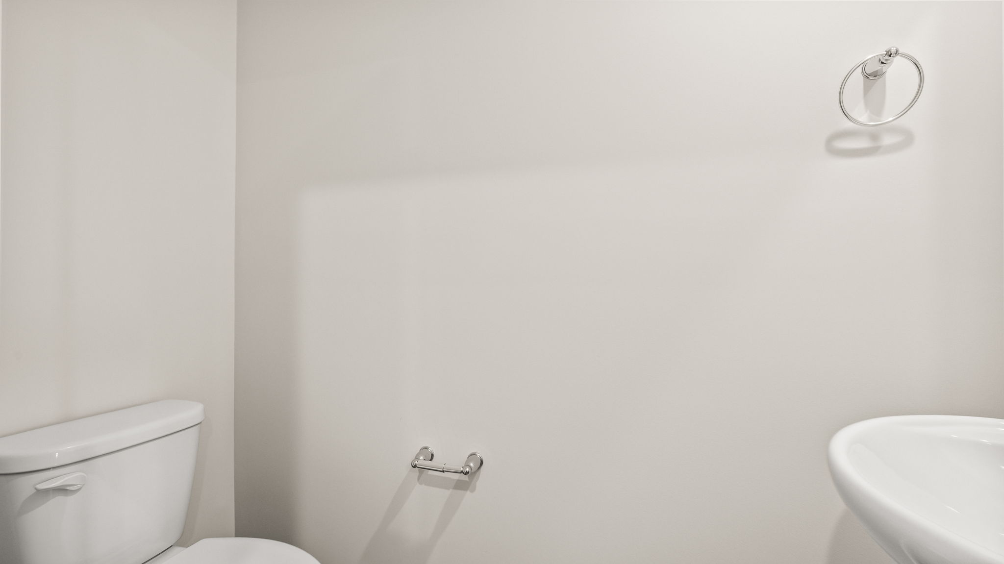 Powder room bathroom with sink and toilet