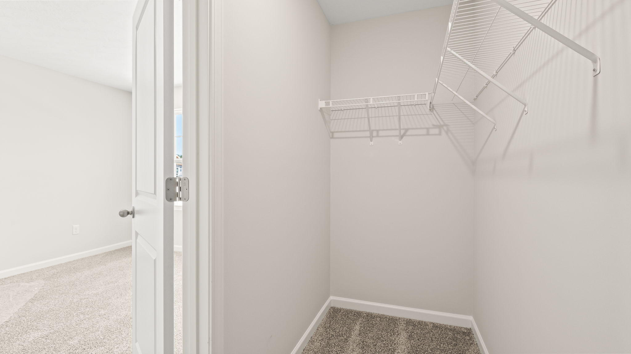 Walk-in closet with wire rack shelving