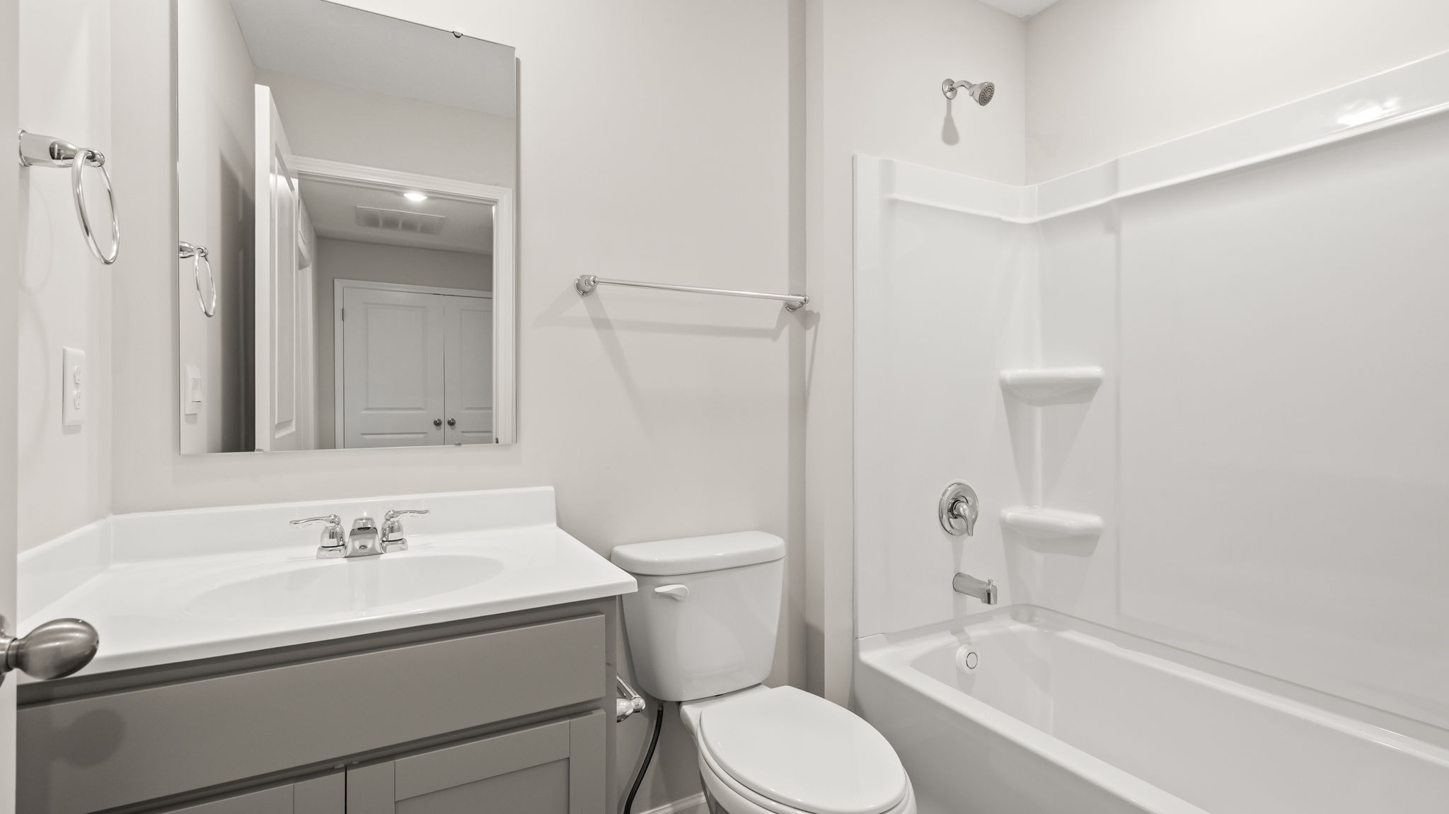 Bathroom with sink, toilet, and tub
