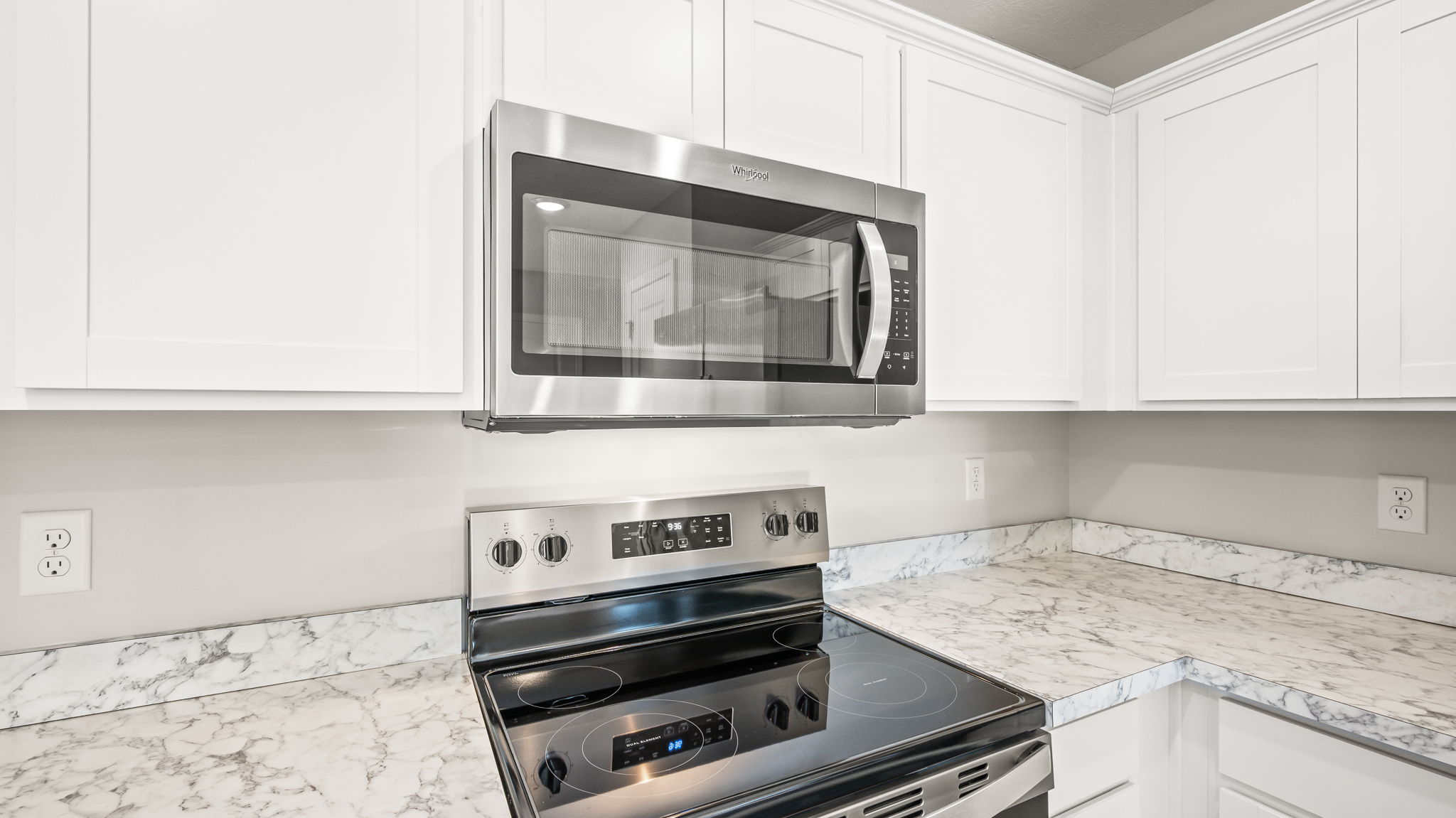 Closeup of oven range between laminate countertops
