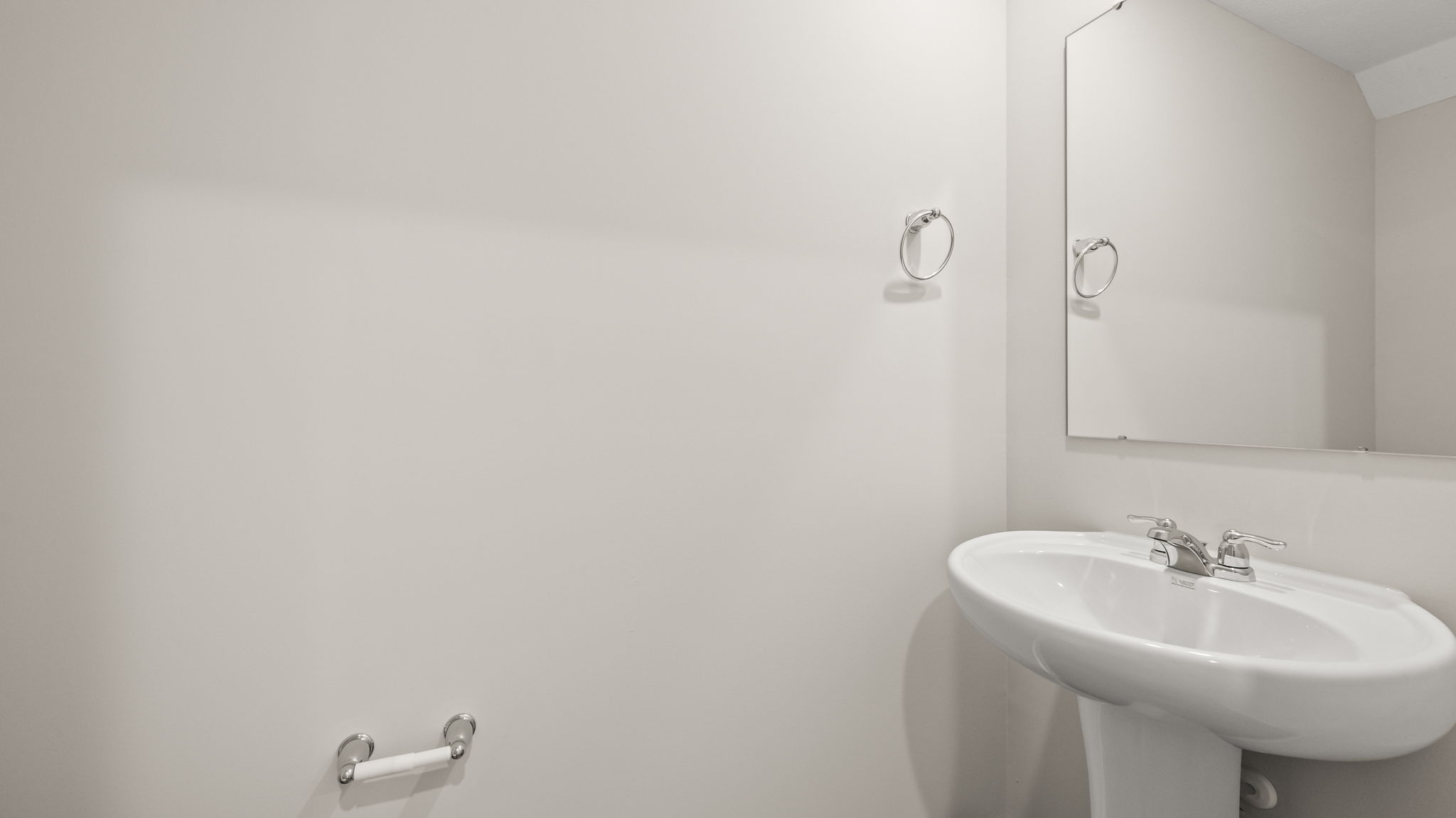 Powder room bathroom with sink and mirror