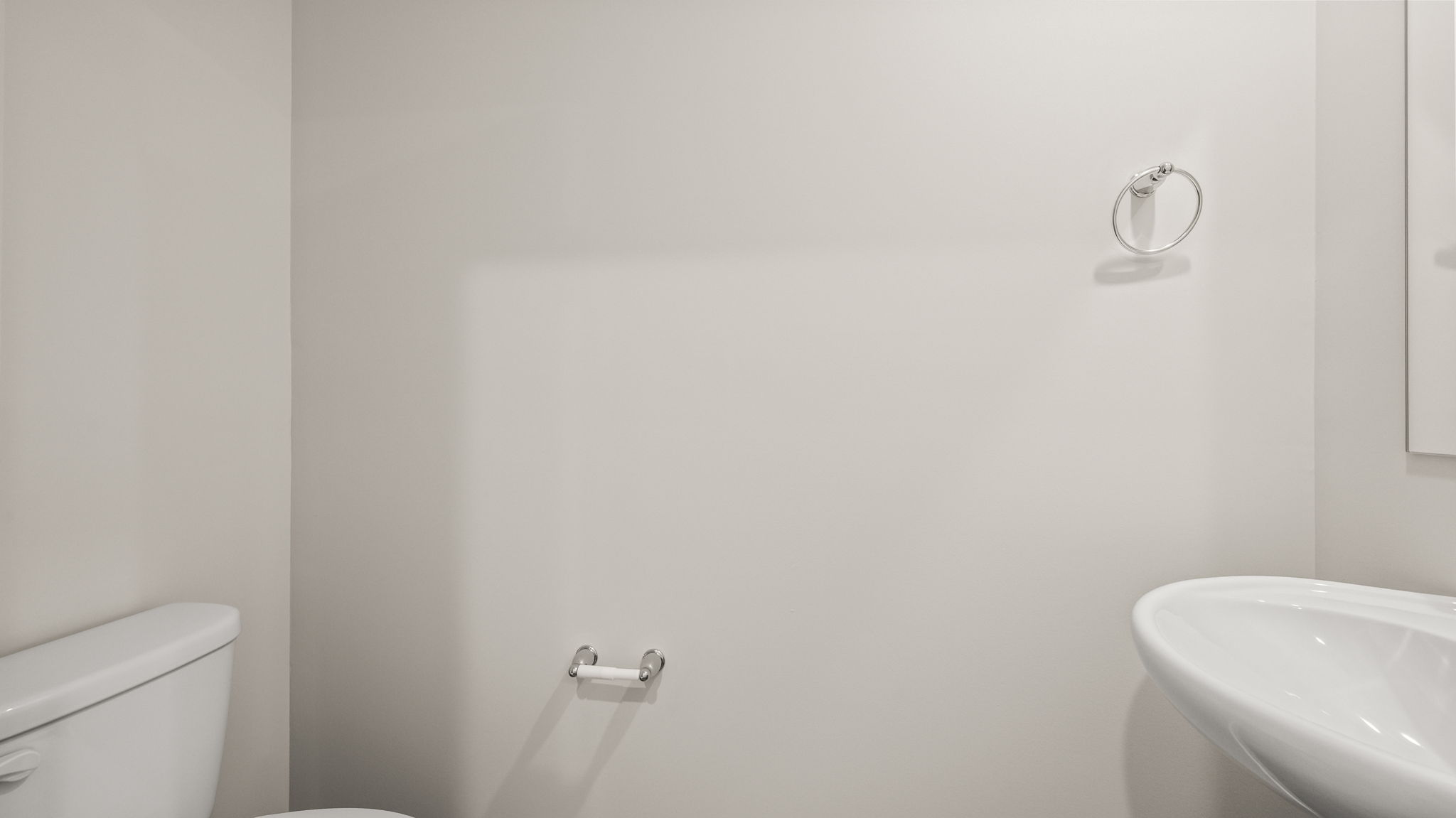 Powder room bathroom with sink and toilet