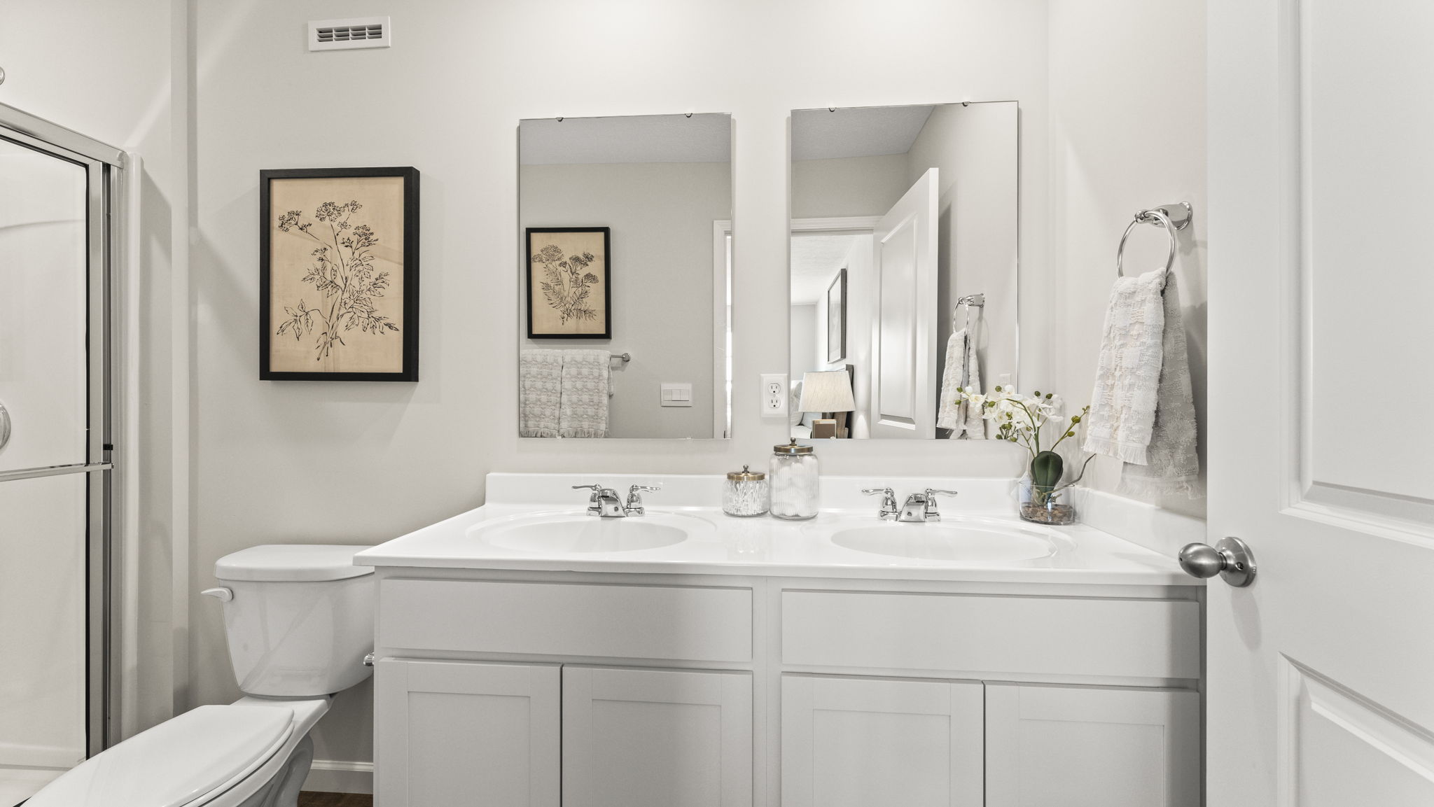 Dual vanity sinks in primary bathroom.
