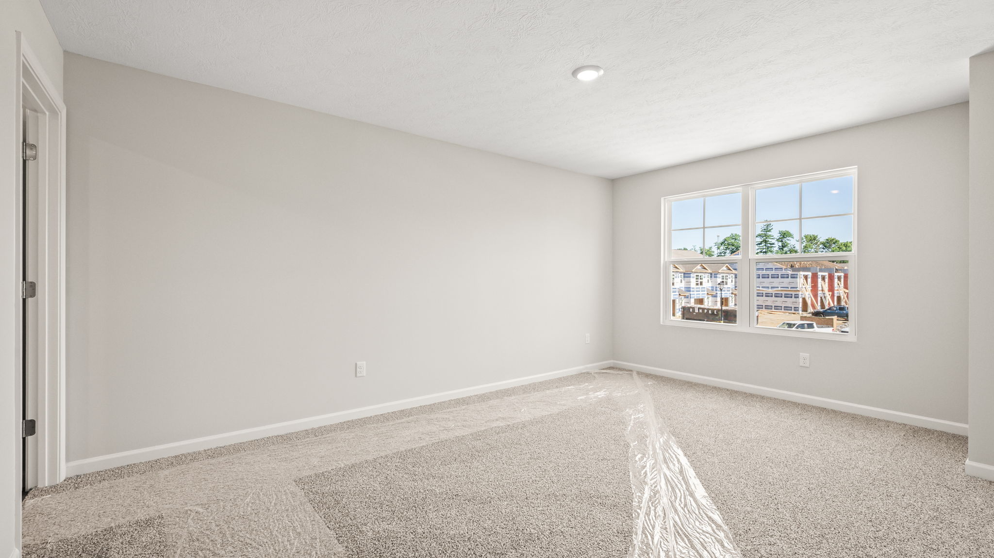 Primary bedroom with window