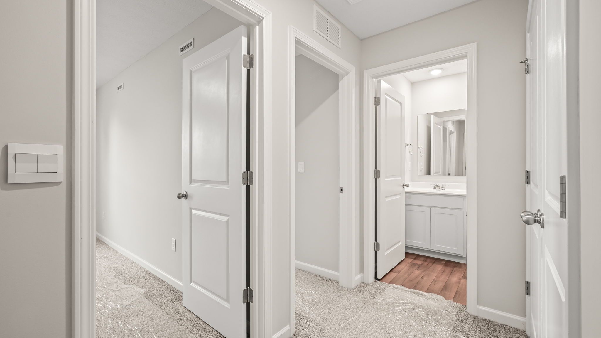 Upstairs hallway leading to bedroom and bathroom