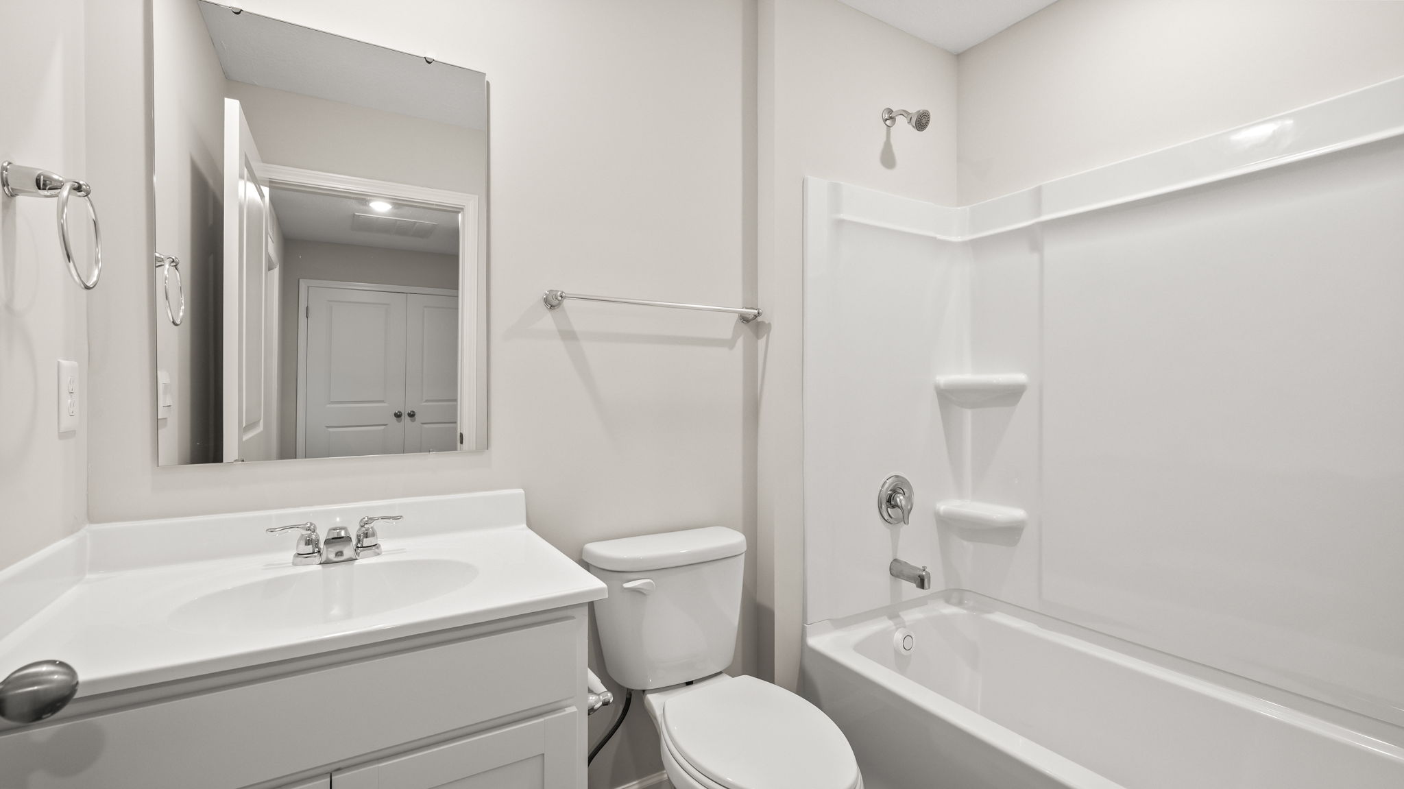 Bathroom with sink, toilet, and tub
