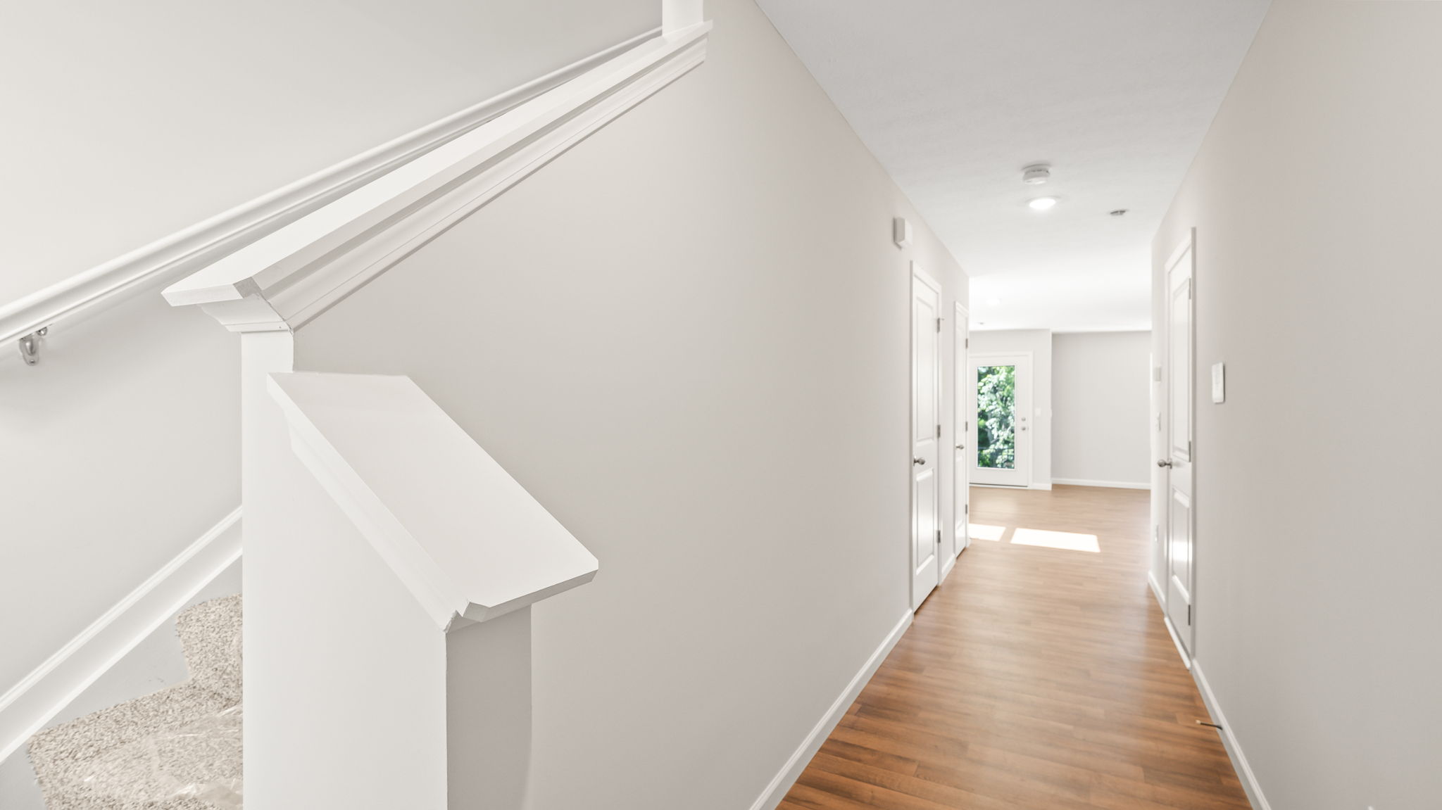 Foyer of townhome leading to great room