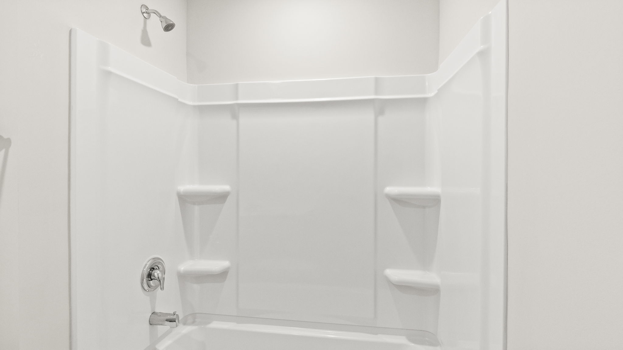 Upstairs bathroom with white tiered shelving in the t