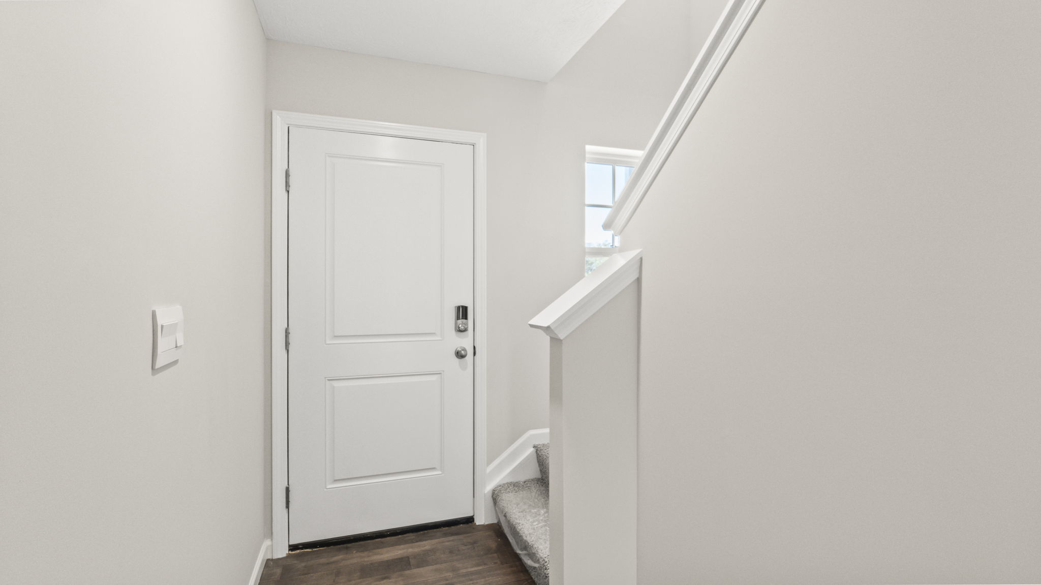 Downstairs foyer looking at front door