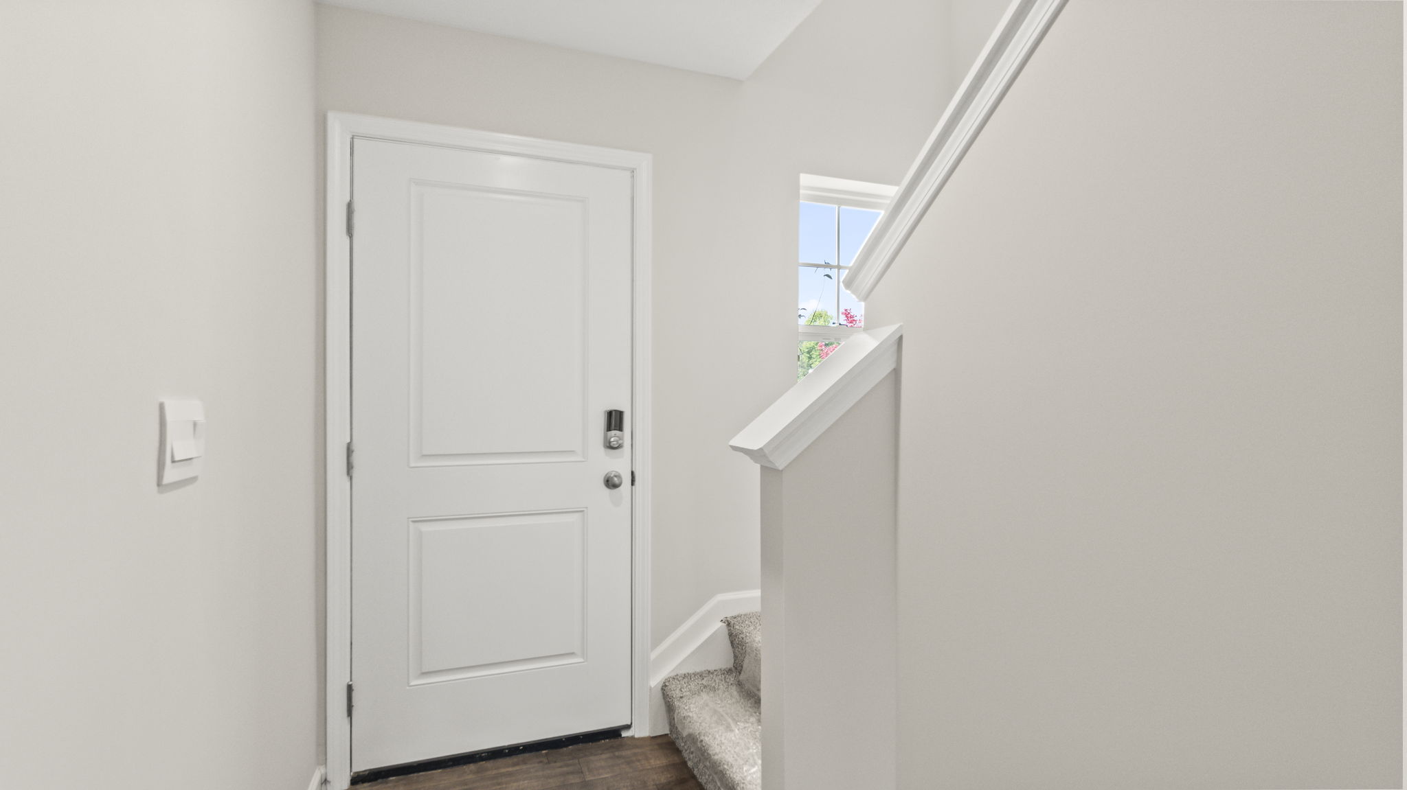 Downstairs foyer looking at front door