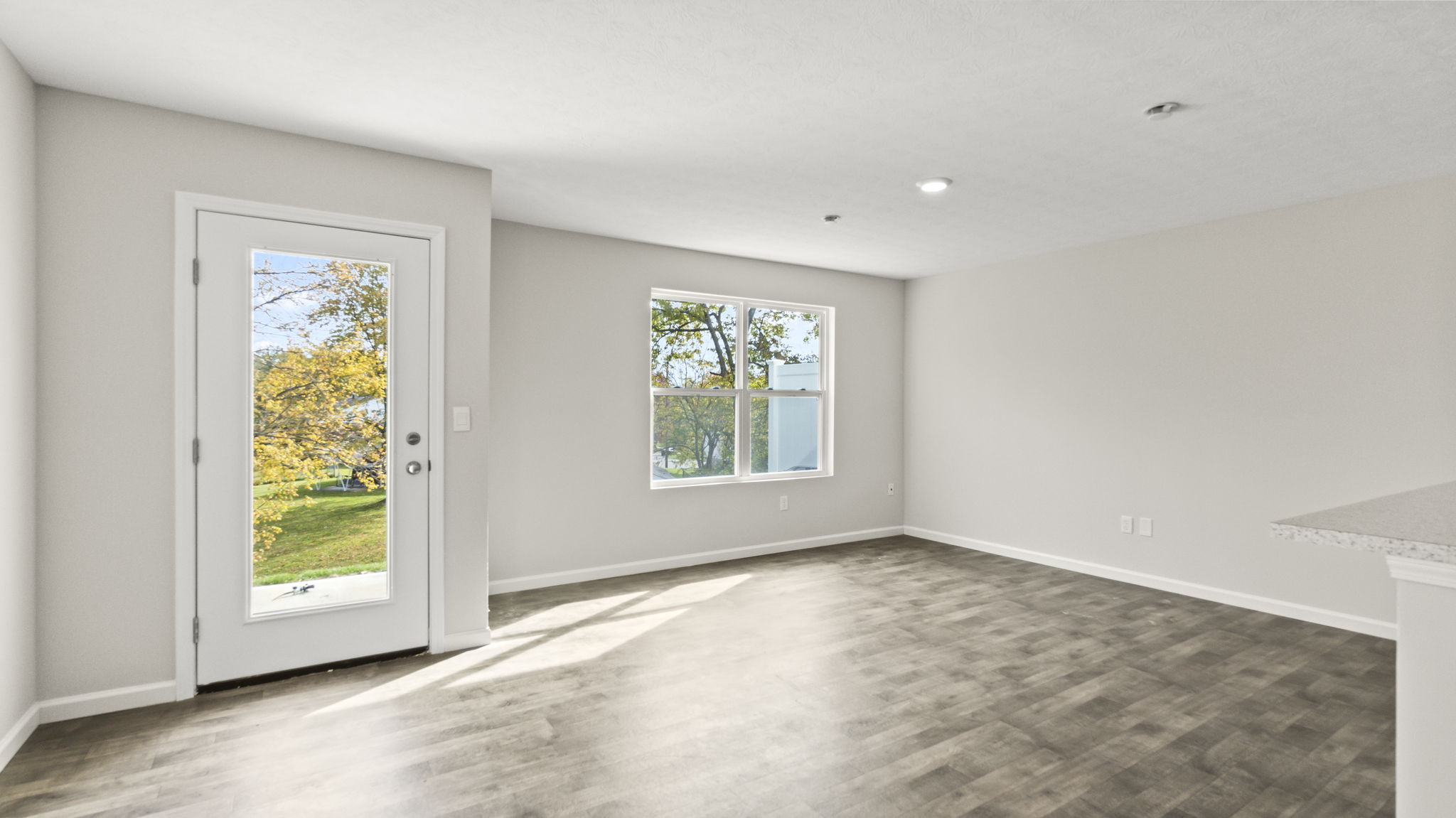 Full great room with window and multiple outlets.