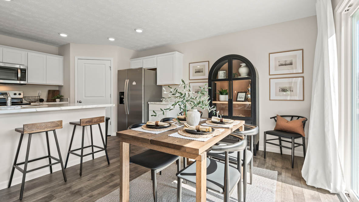 Dining room table with wooden chairs and table.