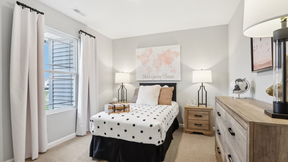 bedroom with wooden furniture and modern art.