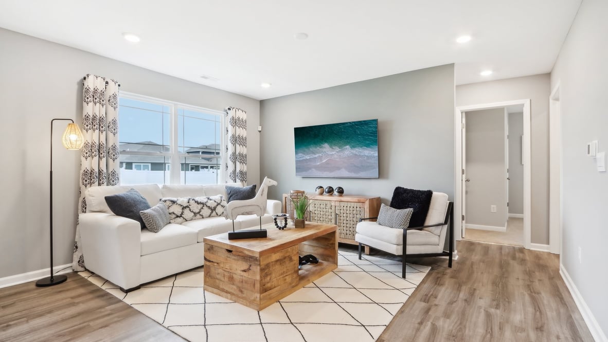 Living room  with modern art and white furniture.