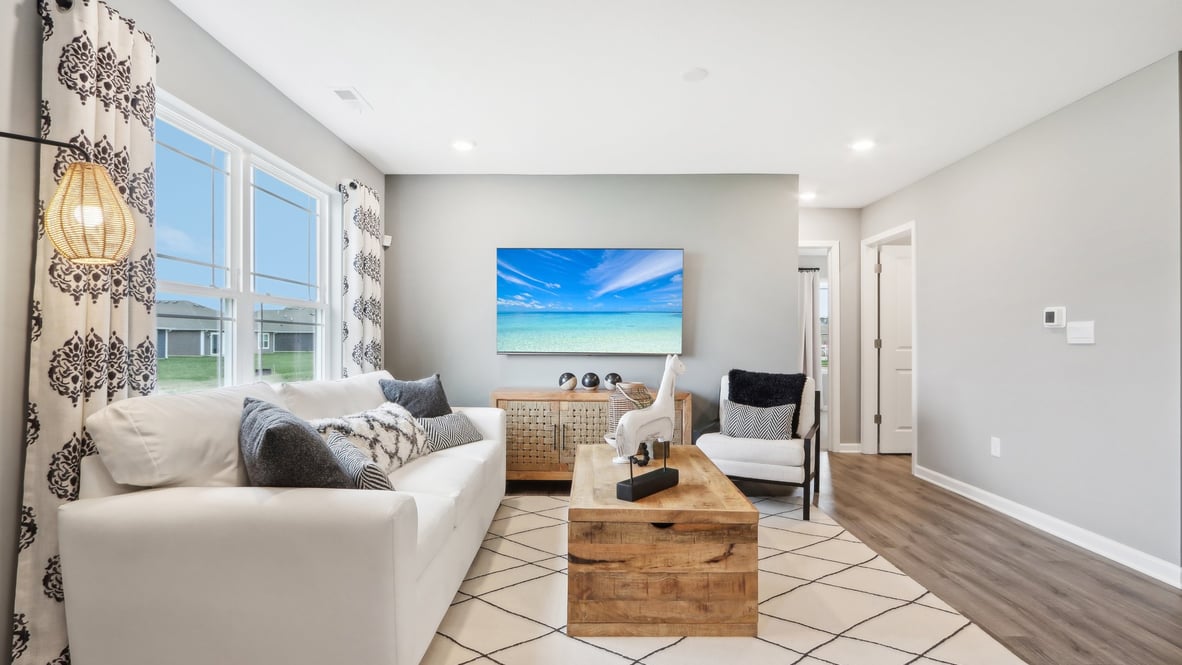 Living room  with modern art and white furniture.