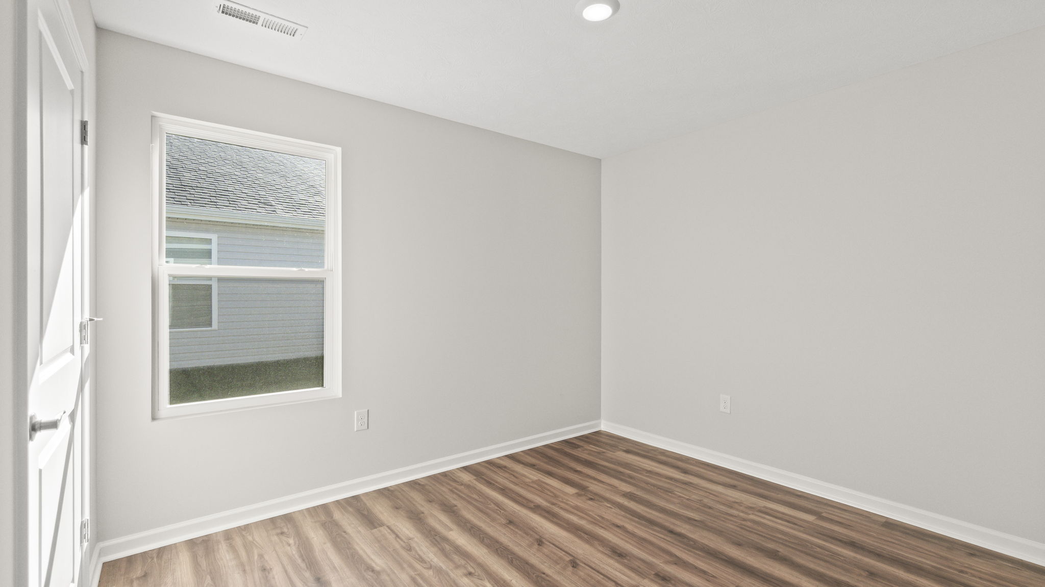 Bedroom with window and closet