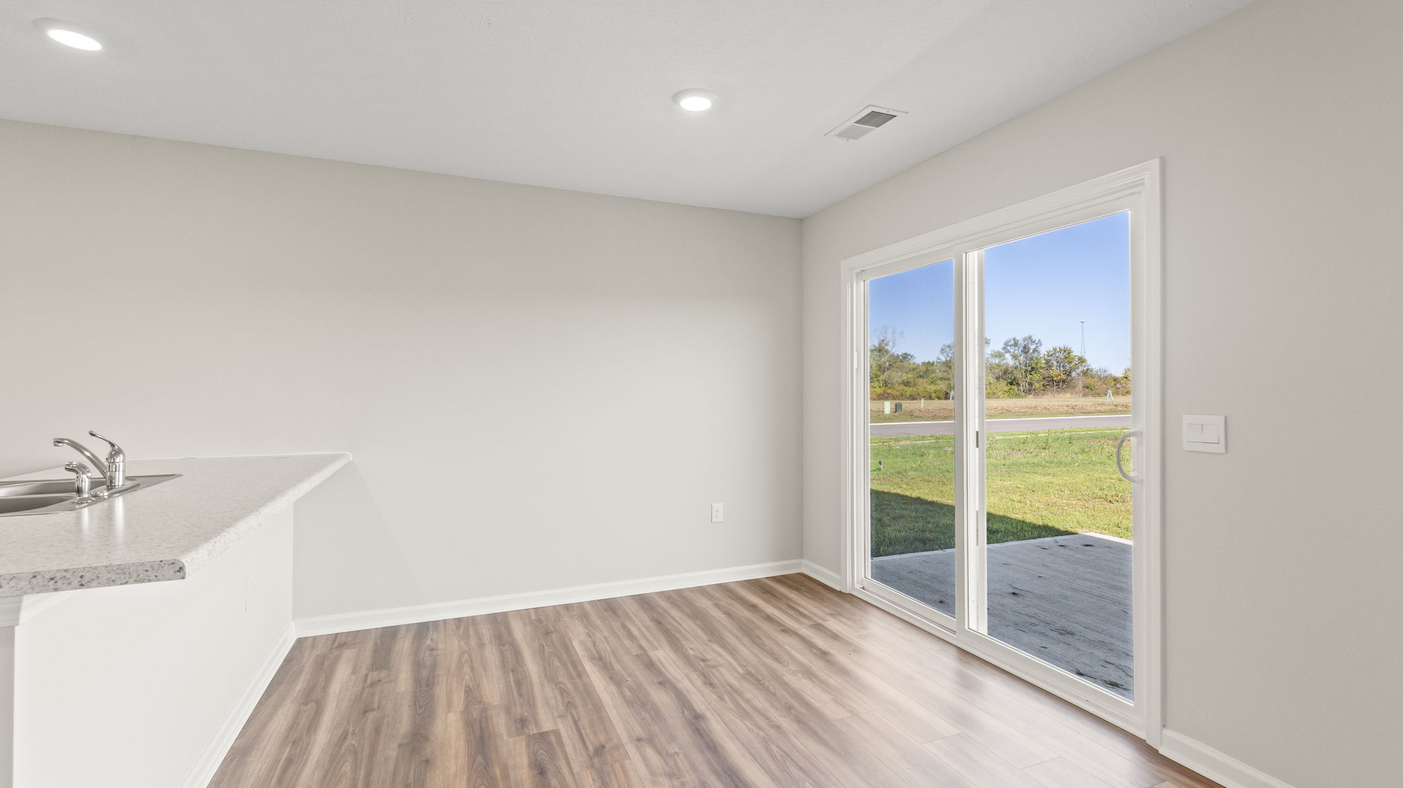 Great room  looking outside at sliding door