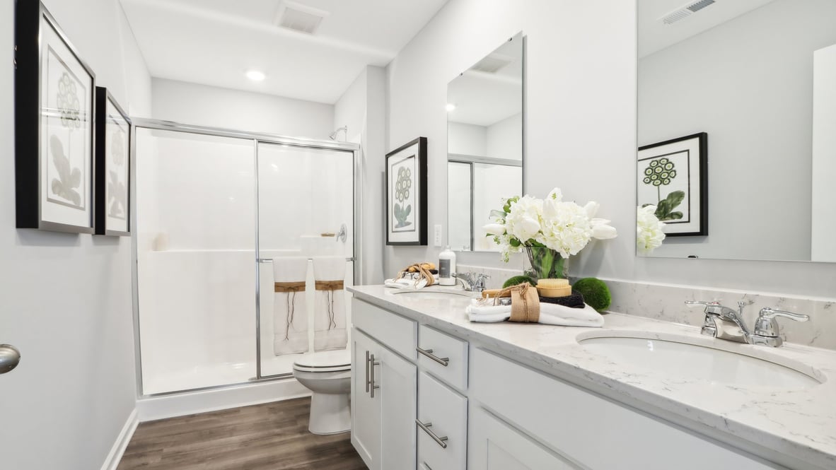 Primary bathroom with modern decorations.