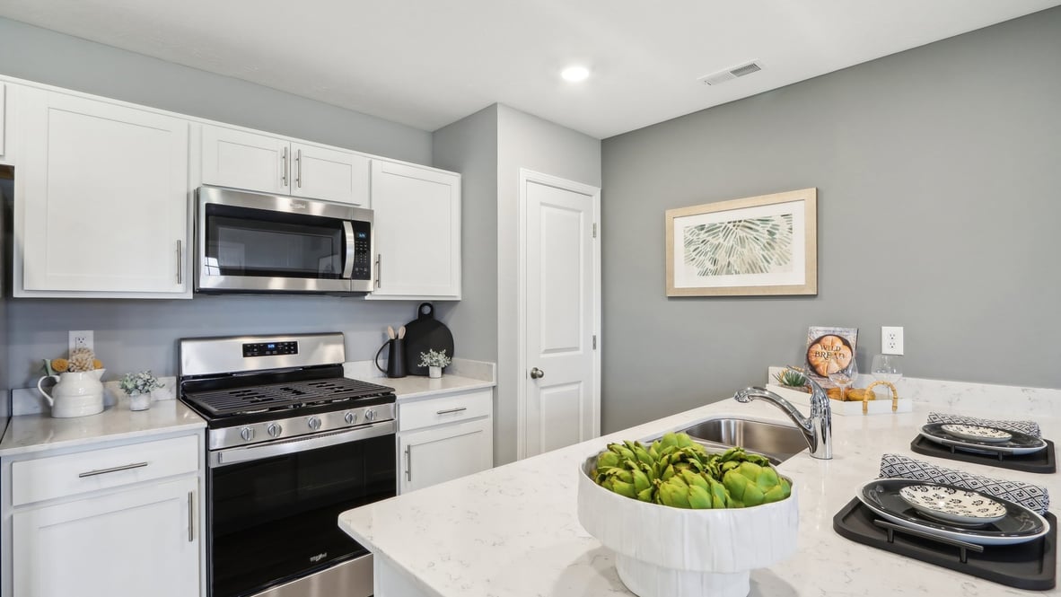 Kitchen with peninsula and stainless steel appliances.