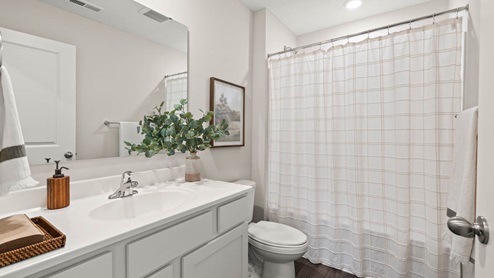 bathroom with toilet and shower