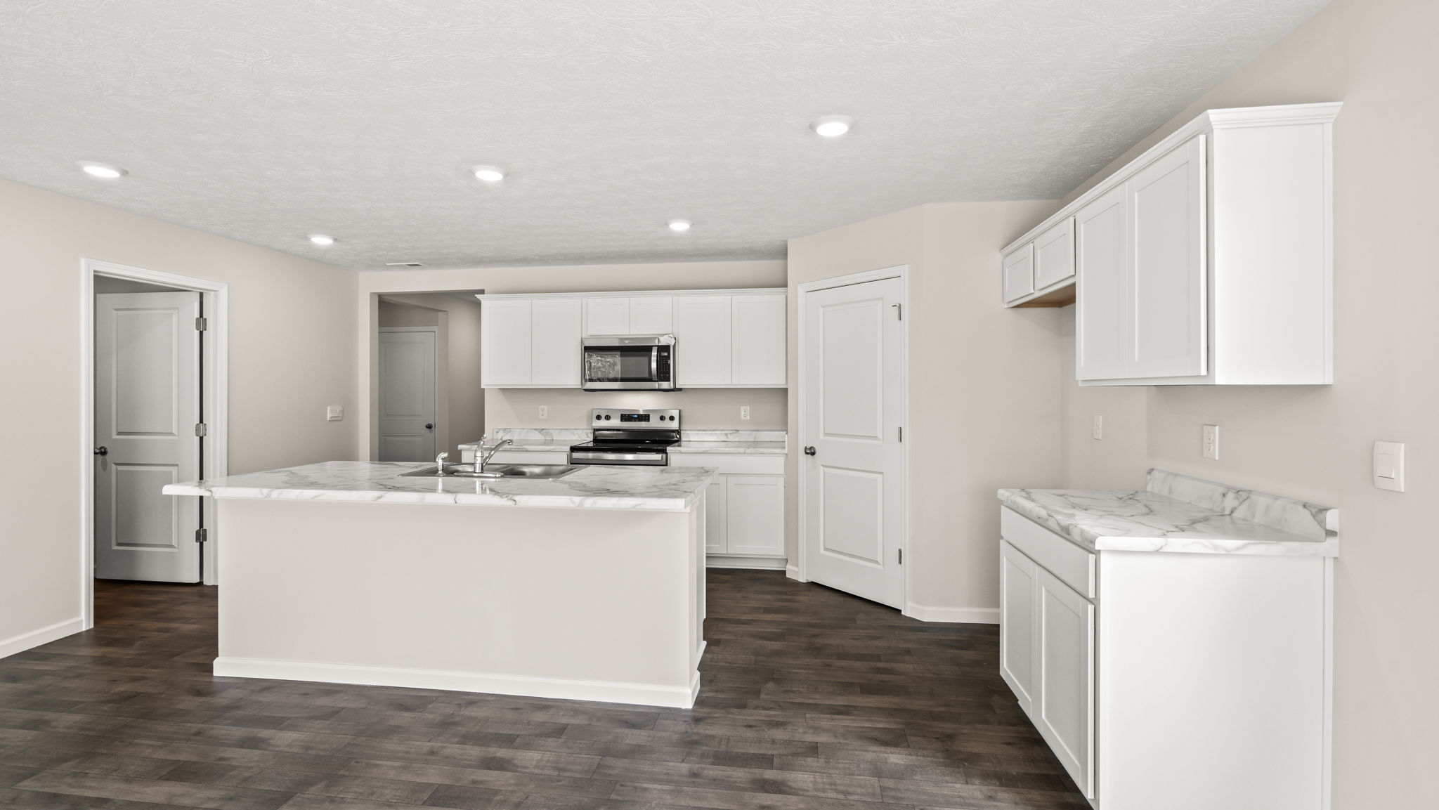 .Kitchen with white cabinetry.