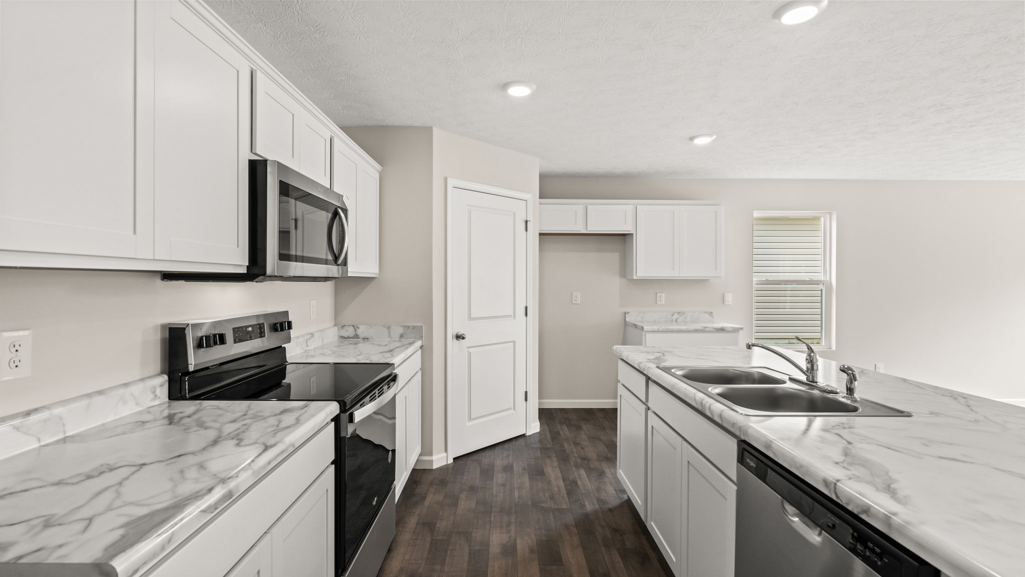 Kitchen with stainless steel appliances and a gas stove.
