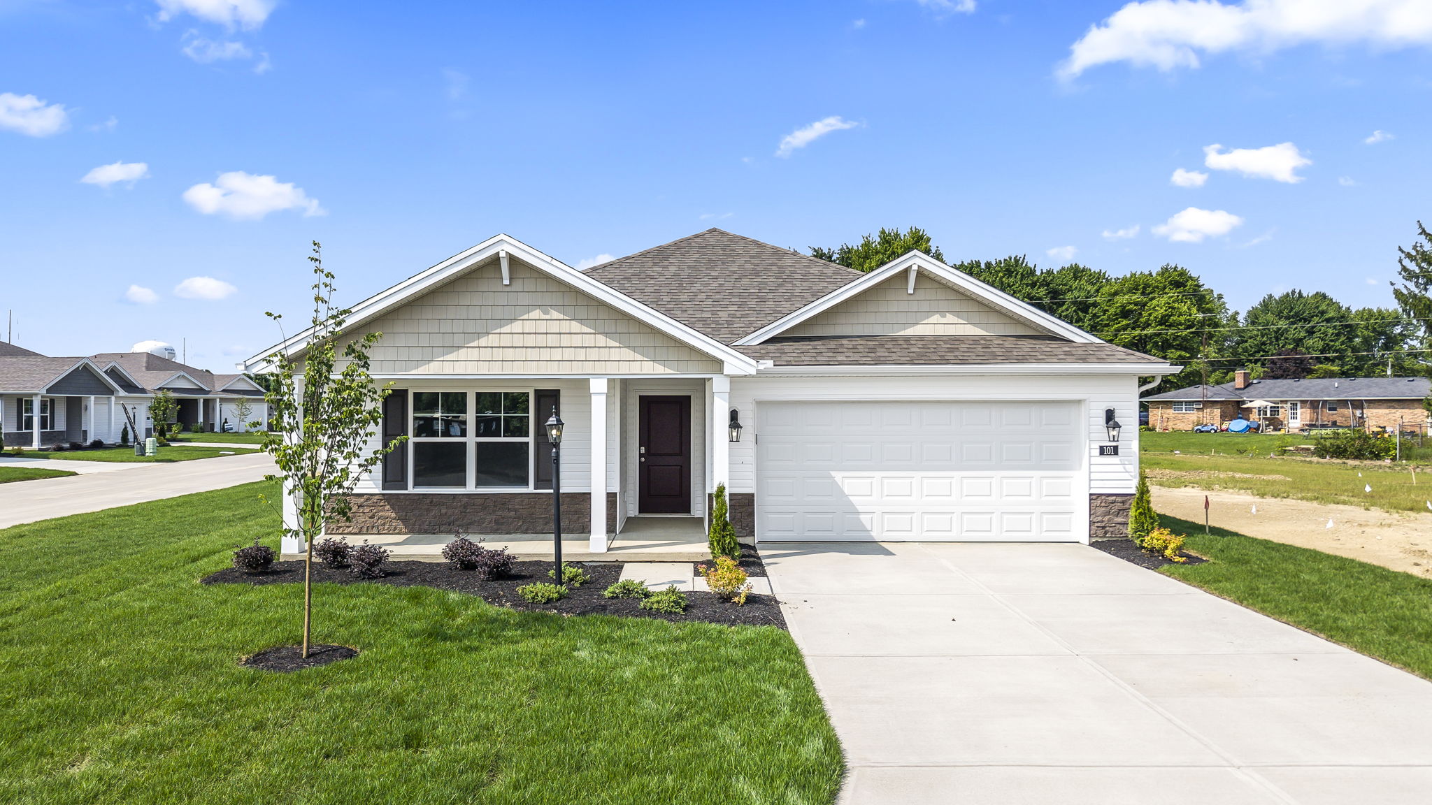 Front exterior of home with two car garage.