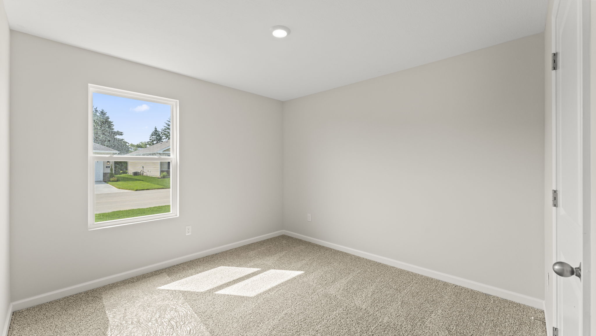 Bedroom with a large window.