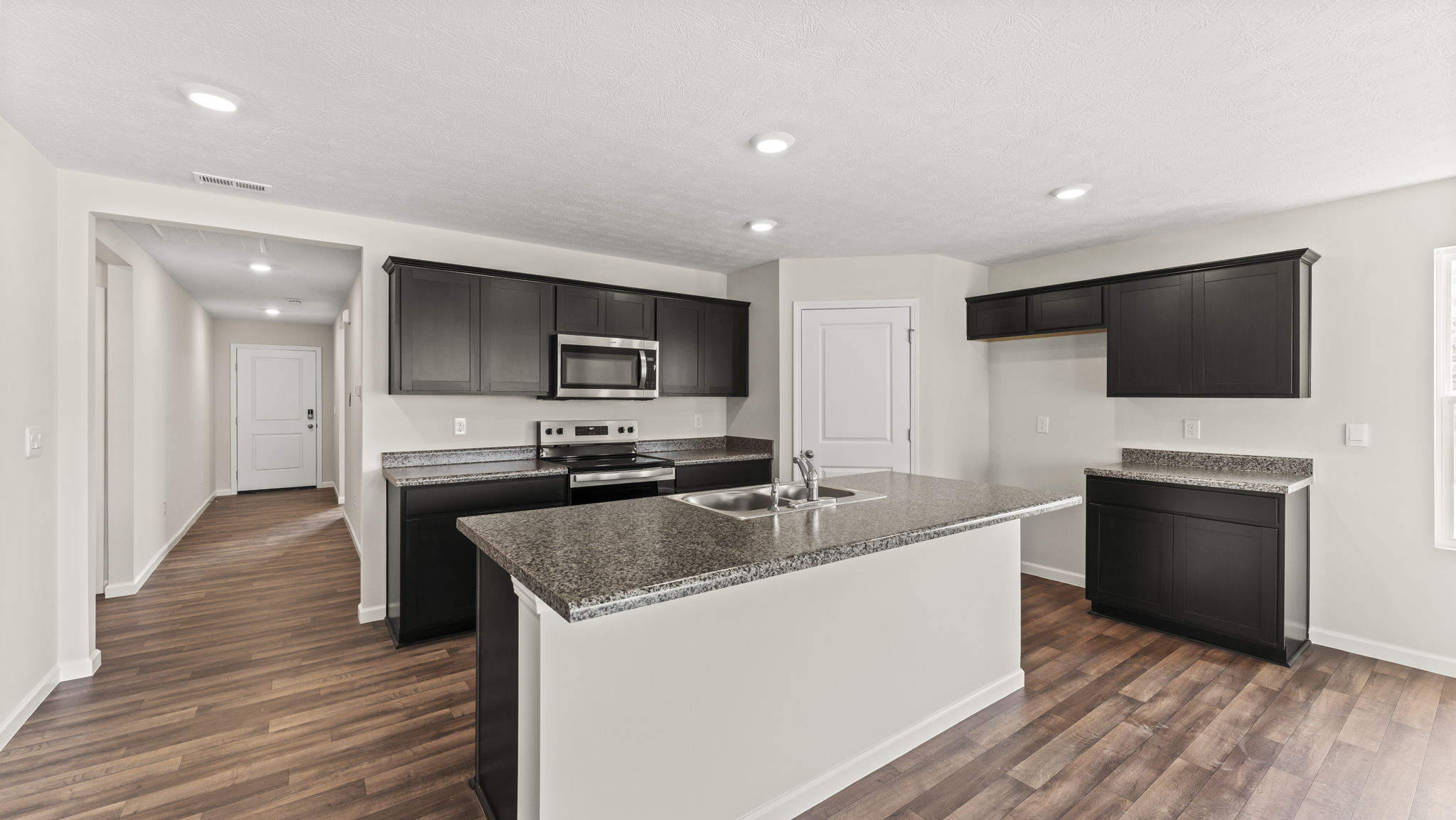 Kitchen with granite countertops.