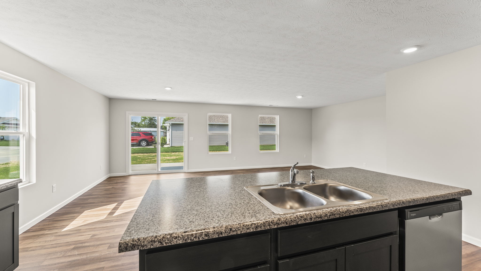 Kitchen with dark granite countertops.