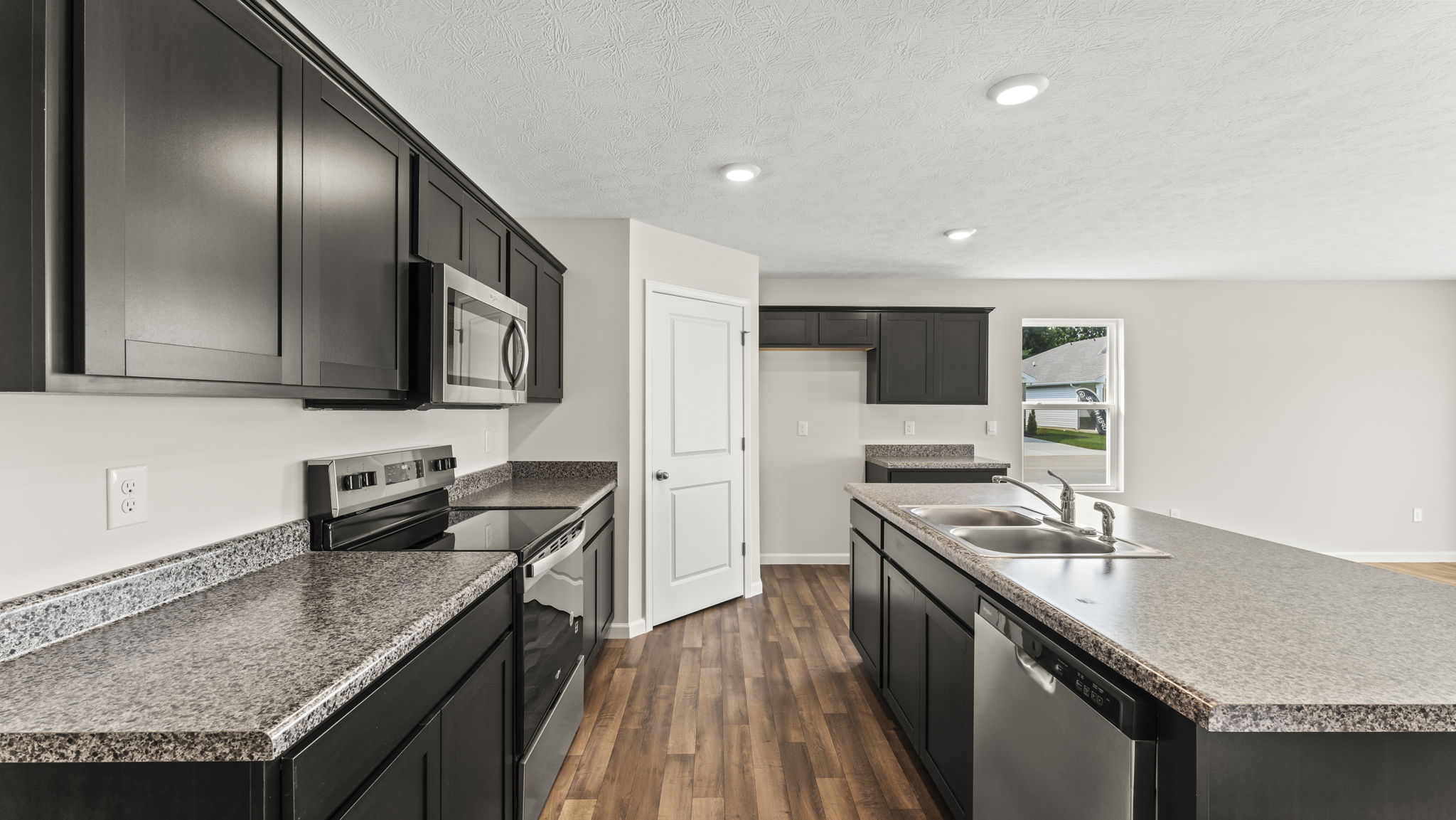 Kitchen with large walk in pantry.