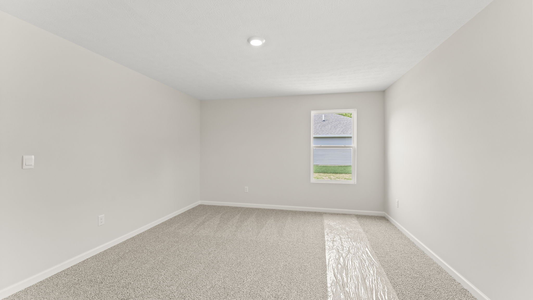 Bedroom with a single window.