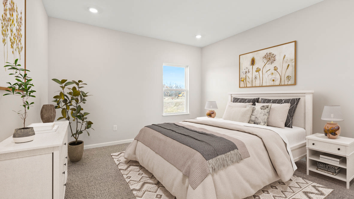 Primary Bedroom with large bed, mathcing bedside tables, and modern art and plants.