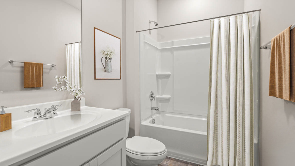 Shared bathroom with sink, toilet, and shower bath combo.