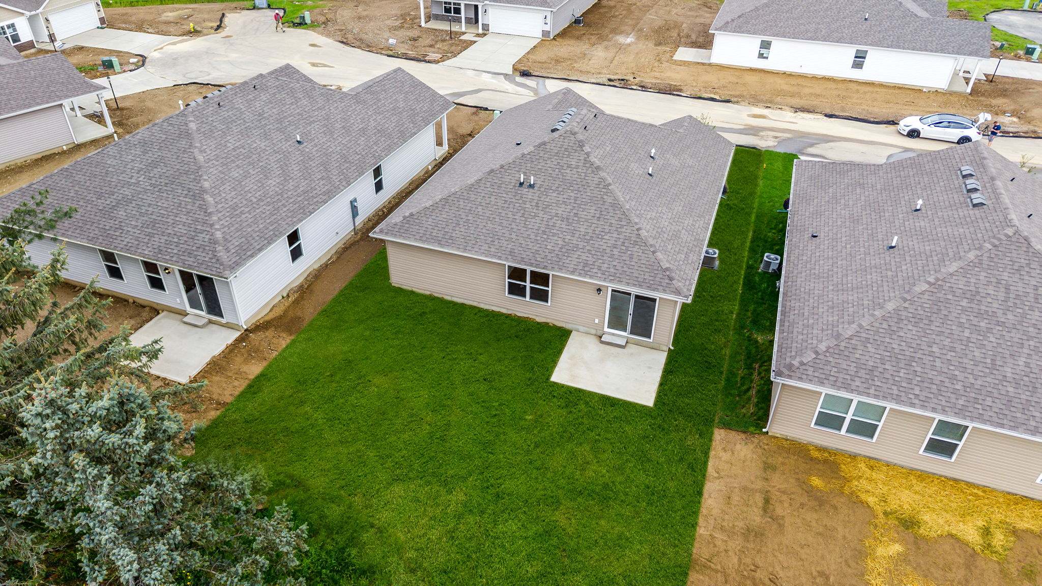 Backyard with concrete porch.