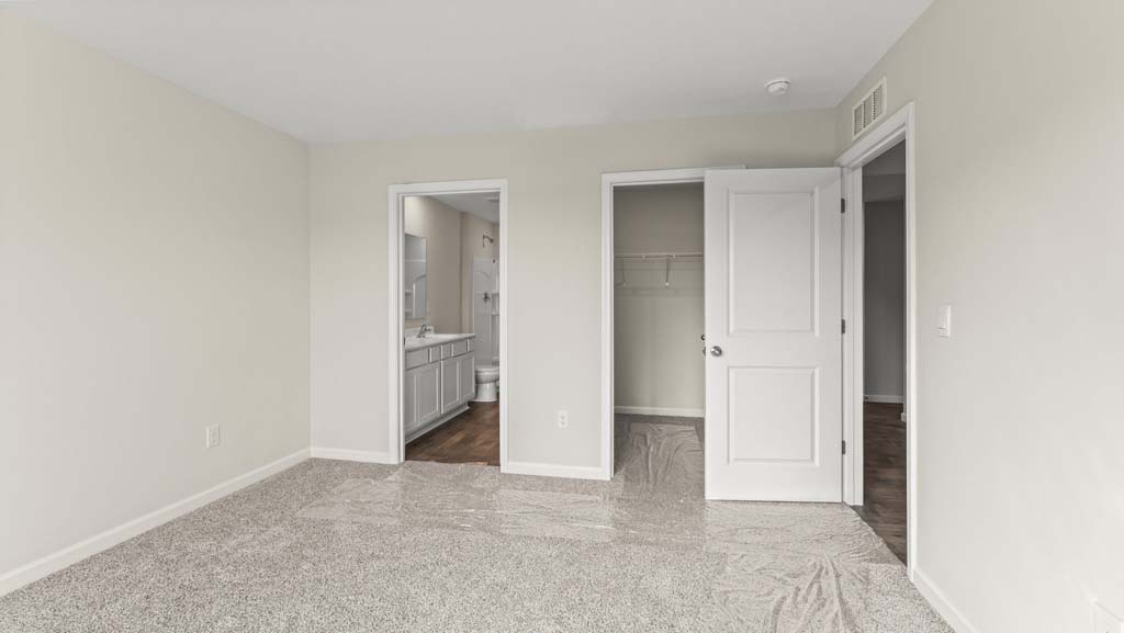 Bedroom with an ensuite bathroom.