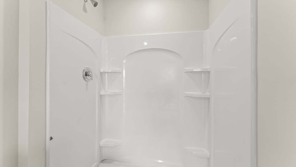 Bathroom with a large walk in shower.