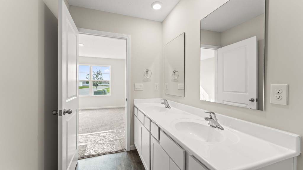 Bathroom with gray cabinetry.