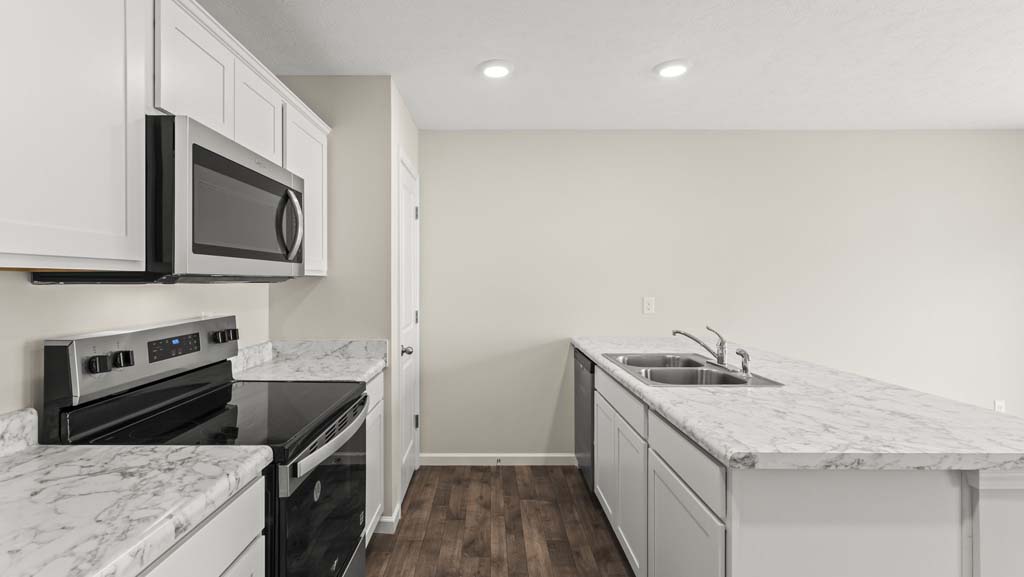 Kitchen with white cabinetry.