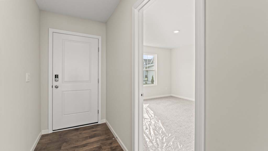 Hallway in between a bathroom and bedrooms.